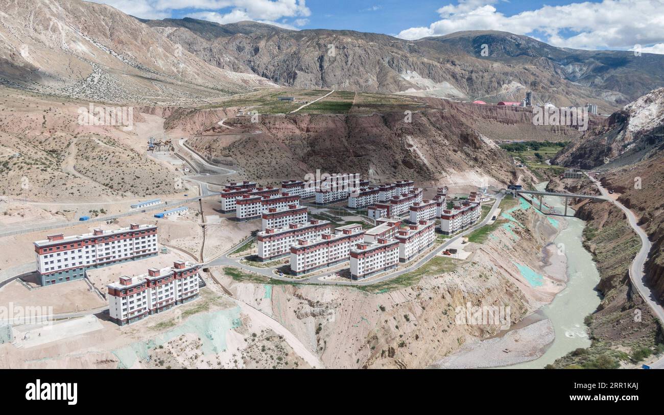 200920 -- LHASA, Sept. 20, 2020 -- Aerial photo taken on Sept. 19, 2020 shows the Xiba poverty-relief relocation site in Baxoi County, Qamdo, southwest China s Tibet Autonomous Region. A cement brick factory near the Xiba poverty-relief relocation site in Baxoi County has offered vocational training and job opportunities to residents from 657 registered impoverished households. Since April, nearly 200 people have attended brick-making training sessions here.  CHINA-TIBET-QAMDO-POVERTY ALLEVIATION CN JigmexDorje PUBLICATIONxNOTxINxCHN Stock Photo