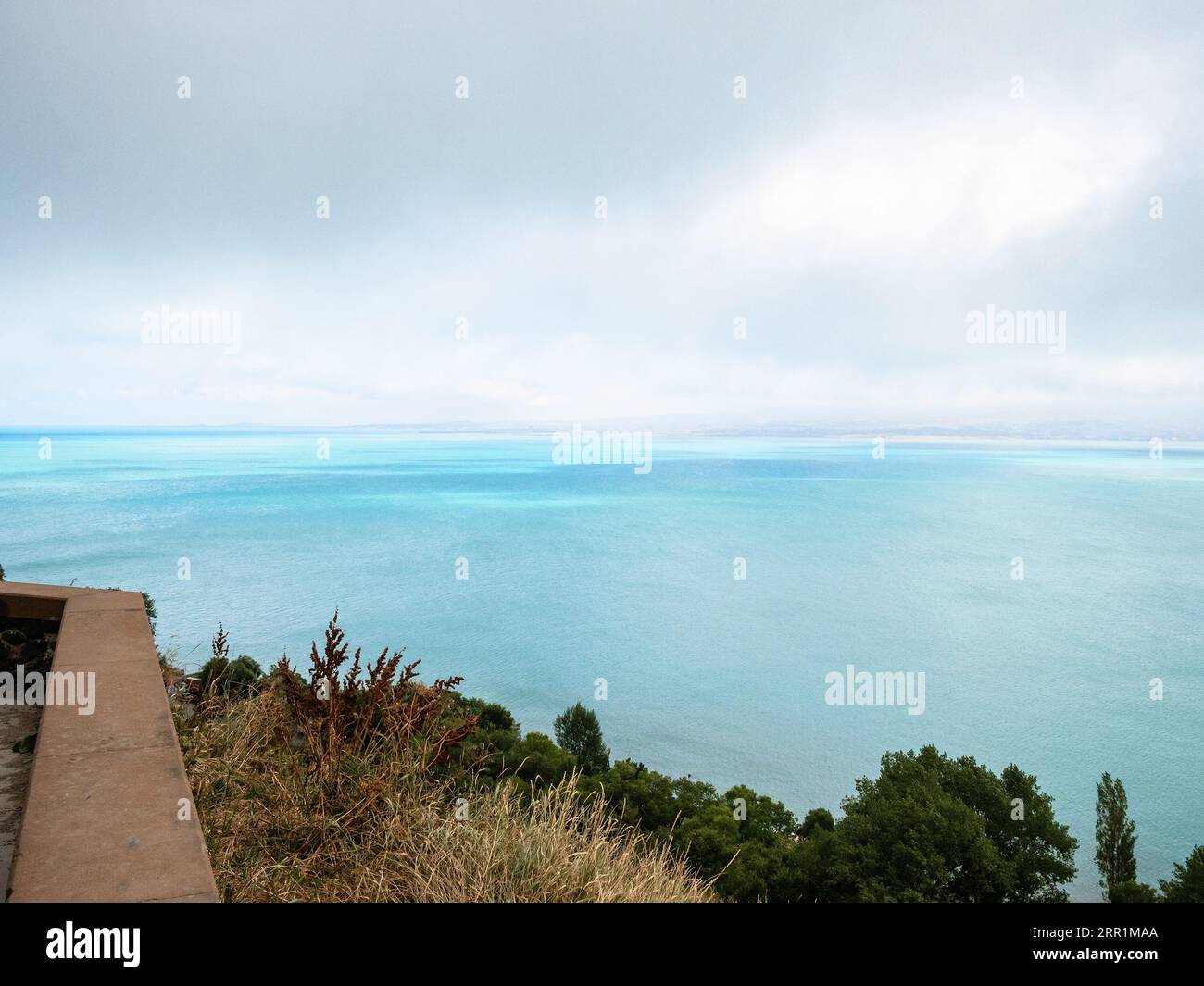 above view of Lake Sevan from Sevan Monastery on cloudy summer day ...