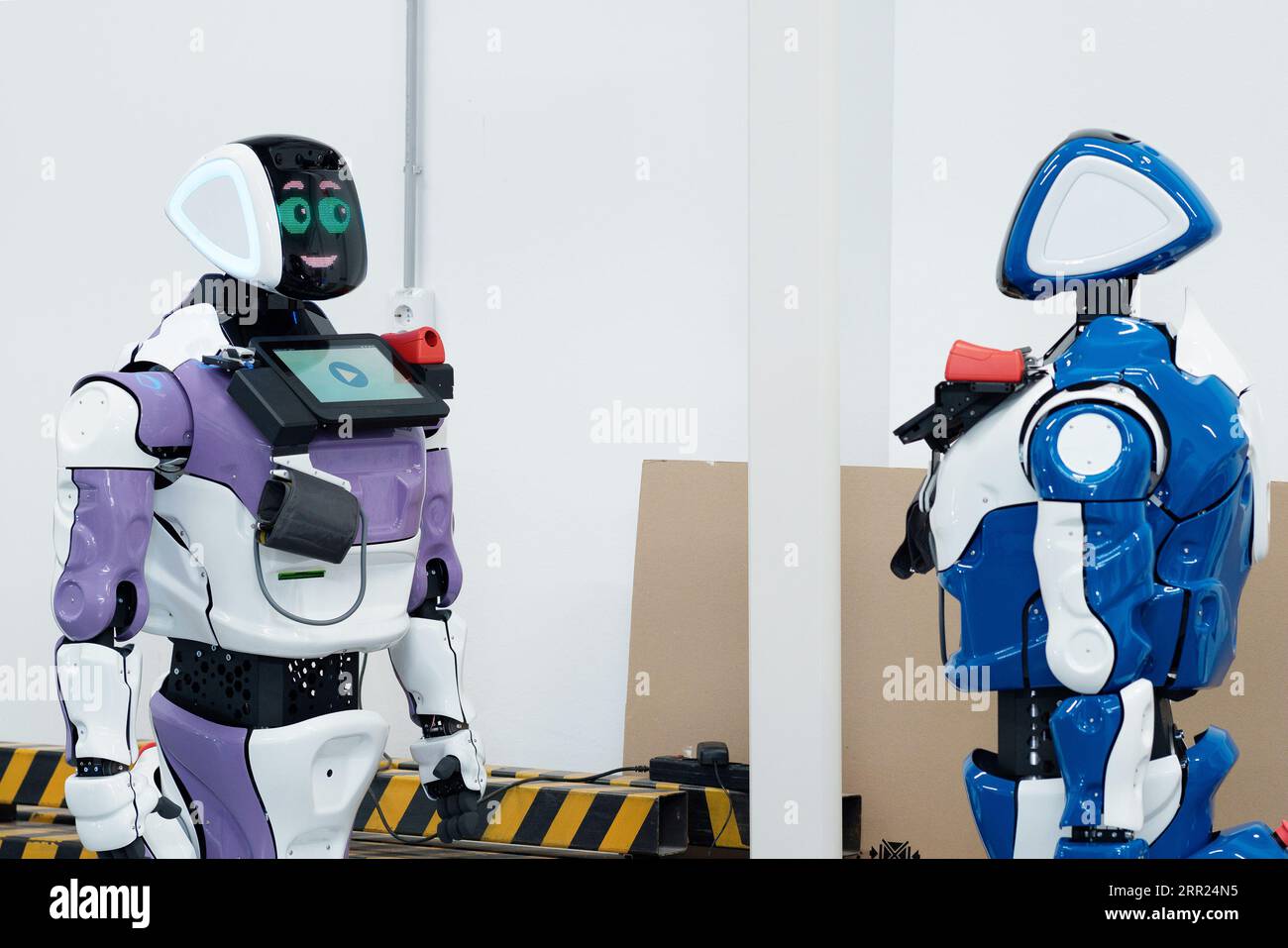 Perm, Russia - July 13, 2023: two humanoid robots with a friendly ...