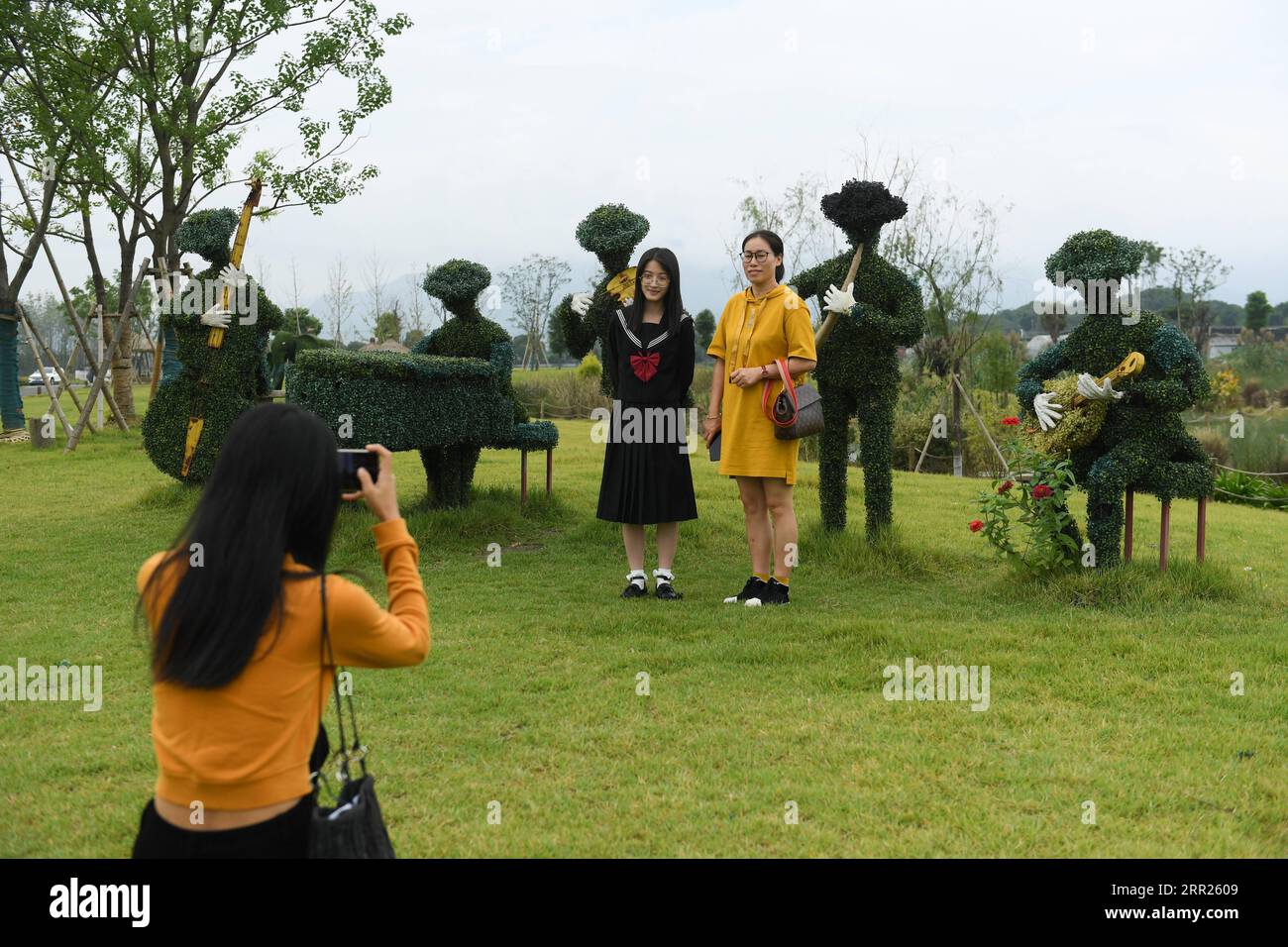 201003 -- HANGZHOU, Oct. 3, 2020 -- Tourists take photos at a scenic spot in Dipu Village in Tonglu County, east China s Zhejiang Province, Sept. 29, 2020. The Hangzhou-Huangshan high-speed railway, linking Hangzhou, capital of east China s Zhejiang Province which is famous for the West Lake, and Huangshan, a tourist resort well-known for the Huangshan Mountain in east China s Anhui Province, was officially put into operation on Dec. 25, 2018.  CHINA-ZHEJIANG-HIGH-SPEED RAILWAY-TOURISM CN WengxXinyang PUBLICATIONxNOTxINxCHN Stock Photo