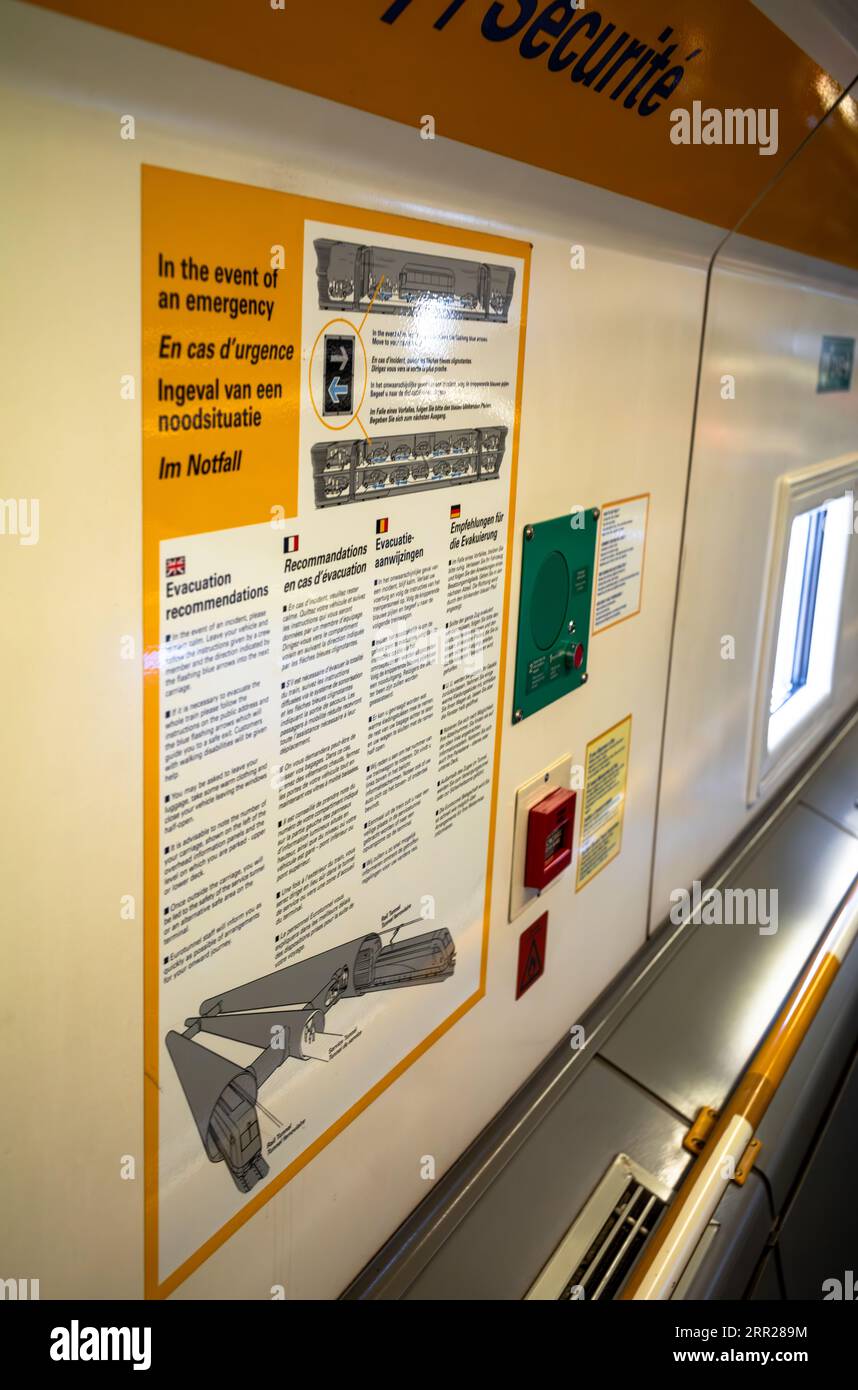 Emergency evacuation instructions on the car-transporting Eurotunnel train known as Le Shuttle using the Channel Tunnel from Folkestone in the UK to C Stock Photo