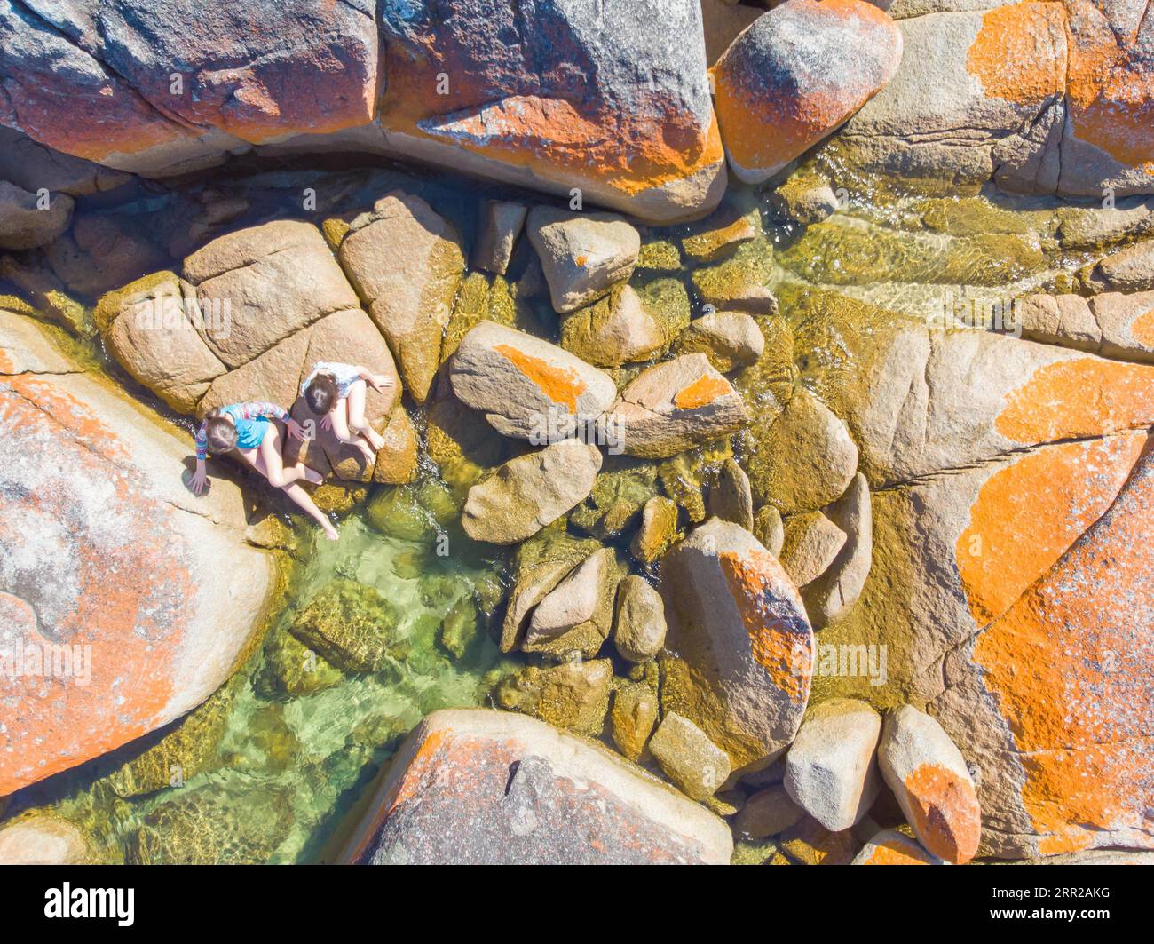 The iconic lichen covered rocks and turqoise ocean water in the Bay of ...