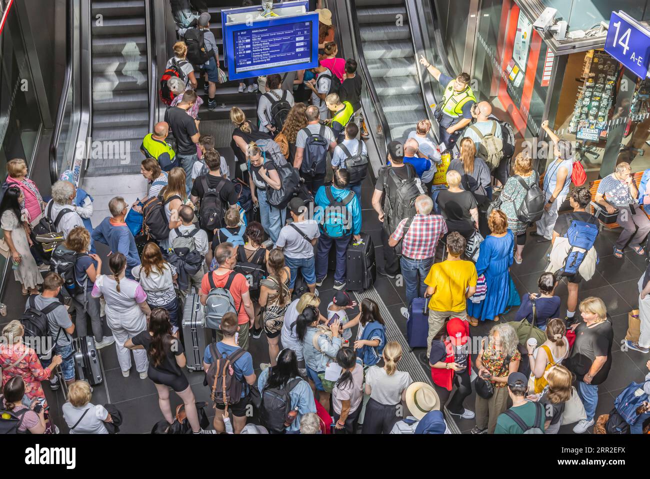 Heavy travel traffic at main station, railway staff temporarily blocking access to platforms, travellers at main station, Berlin, Germany Stock Photo