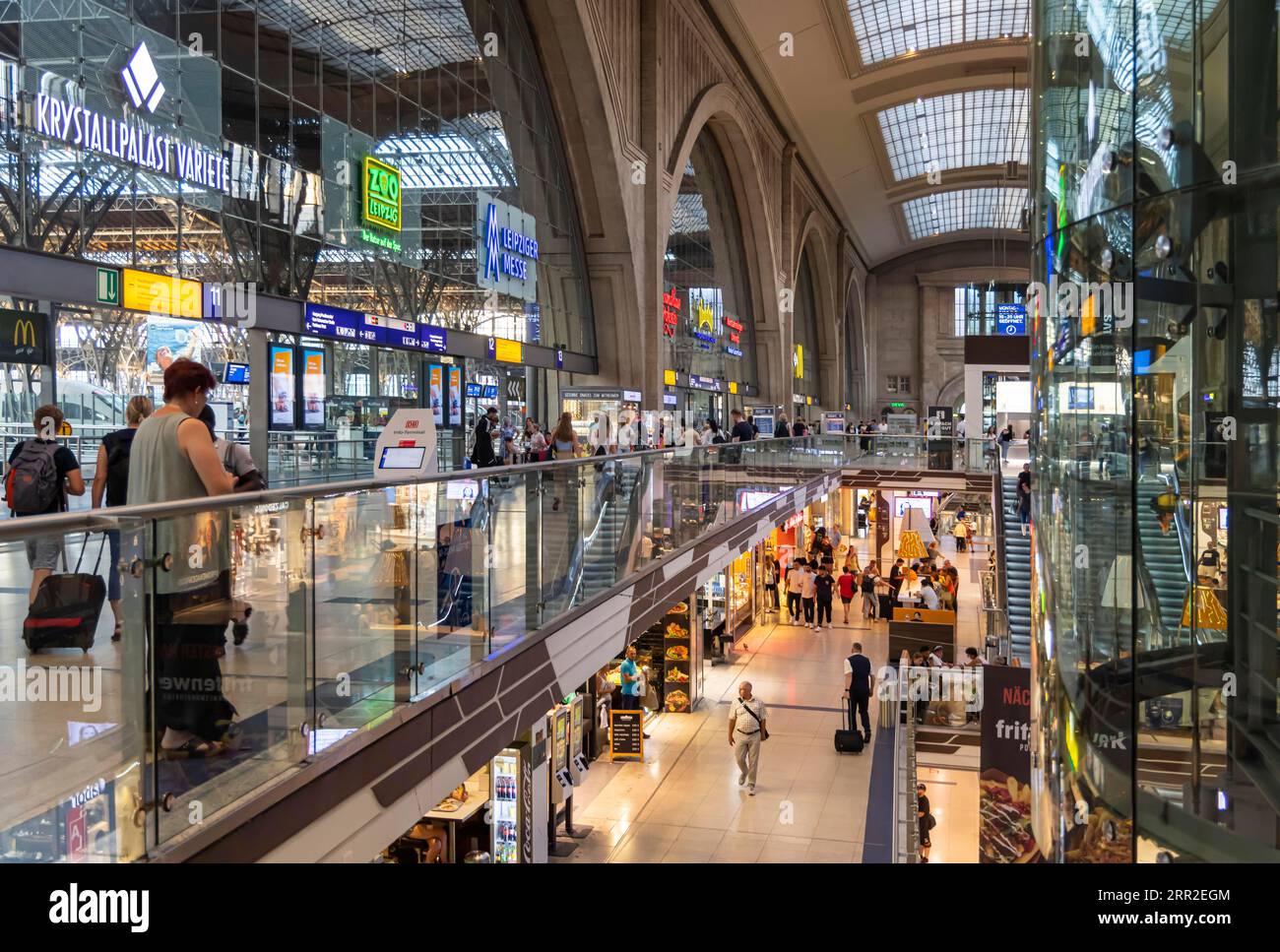 Promenades in the station building of Leipzig Central Station. Over 140 shops, restaurants and service providers on three floors fill the interior of Stock Photo