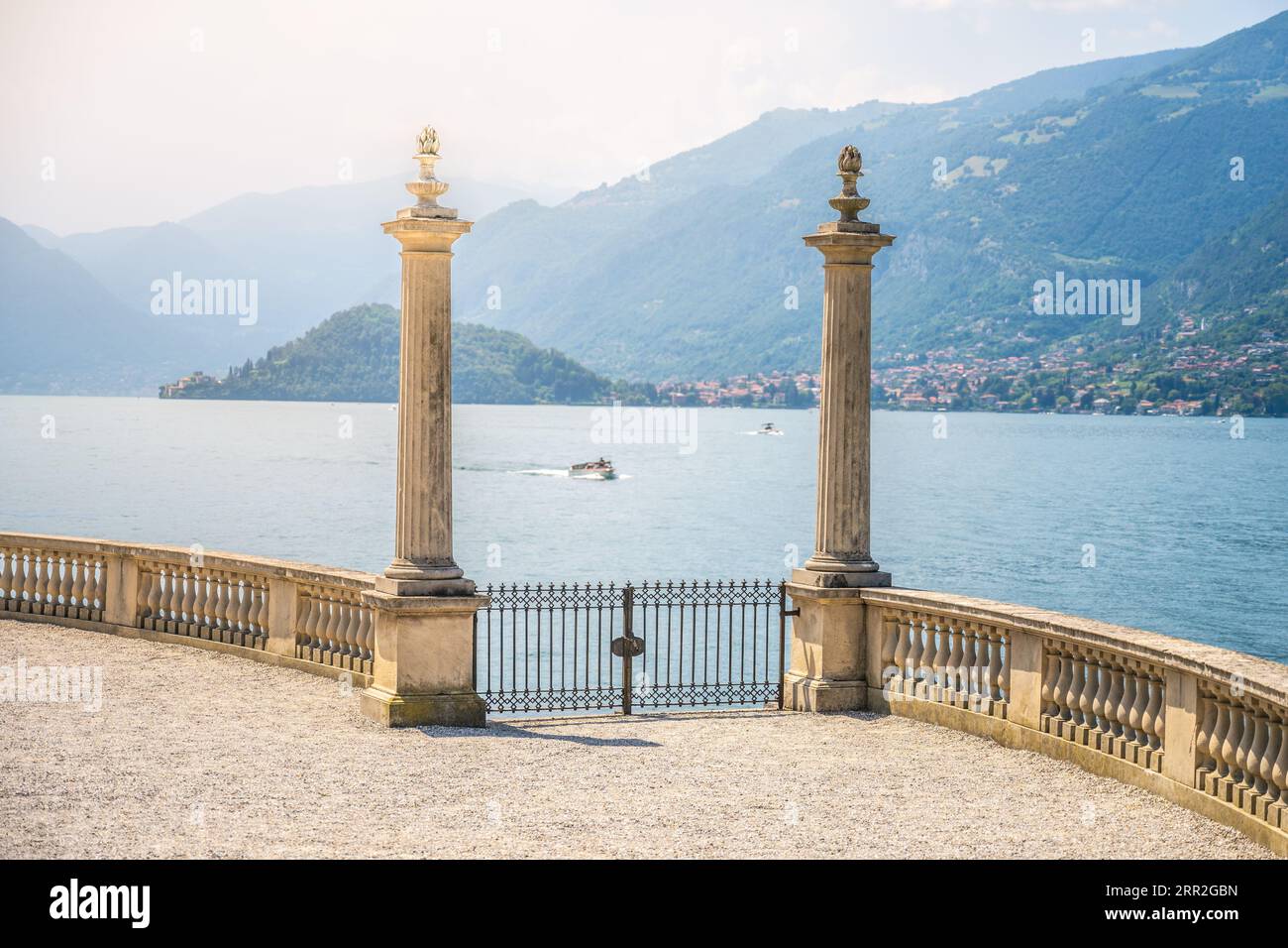 Ornamental gate with roman columns to Como Lake, Italian: Lago di Como, Bellagio, Lombardy, Italy Stock Photo
