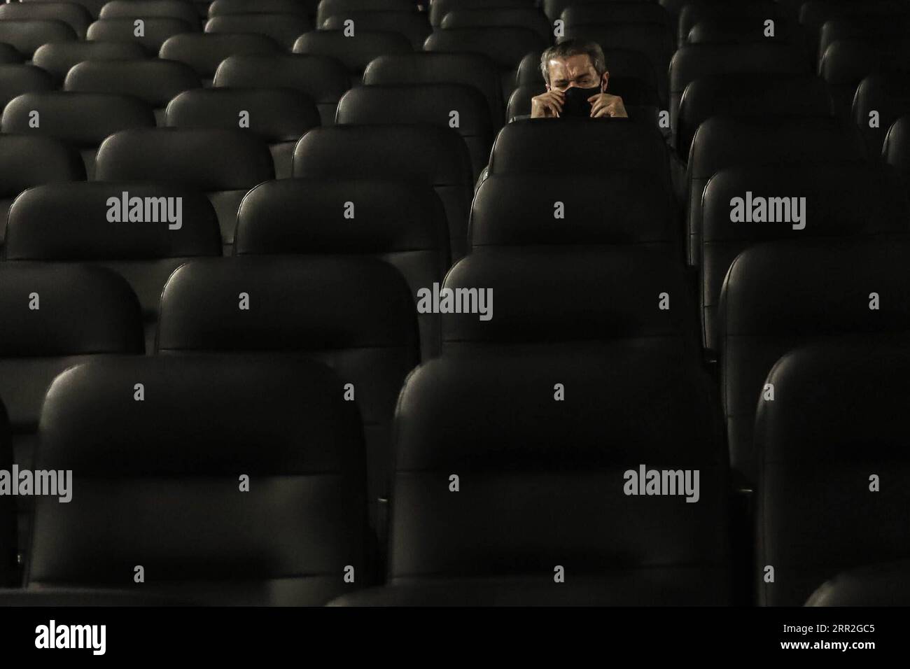 201012 -- BEIJING, Oct. 12, 2020 -- A man sits at the reopened Belas Artes cinema in Sao Paulo, Brazil on Oct. 10, 2020. The Brazilian city of Sao Paulo has allowed cinemas, theaters, museums, and other cultural spaces to reopen starting on Saturday, as cases of the novel coronavirus COVID-19 as well as hospital occupancy have declined, authorities announced on Friday. Photo by /Xinhua XINHUA PHOTOS OF THE DAY RahelxPatrasso PUBLICATIONxNOTxINxCHN Stock Photo