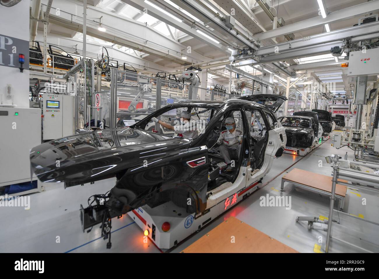 201012 -- CHANGCHUN, Oct. 12, 2020 -- Workers assemble cars at a factory of the First Automotive Works FAW Group Co., Ltd. in Changchun, capital of northeast China s Jilin Province, Sept. 23, 2020. China s leading automaker First Automotive Works FAW Group Co., Ltd. sold 2,656,744 vehicles in the first three quarters of the year, up 8 percent year on year, according to corporate sources.  CHINA-CHANGCHUN-FAW-SALES-GROWTH CN ZhangxNan PUBLICATIONxNOTxINxCHN Stock Photo