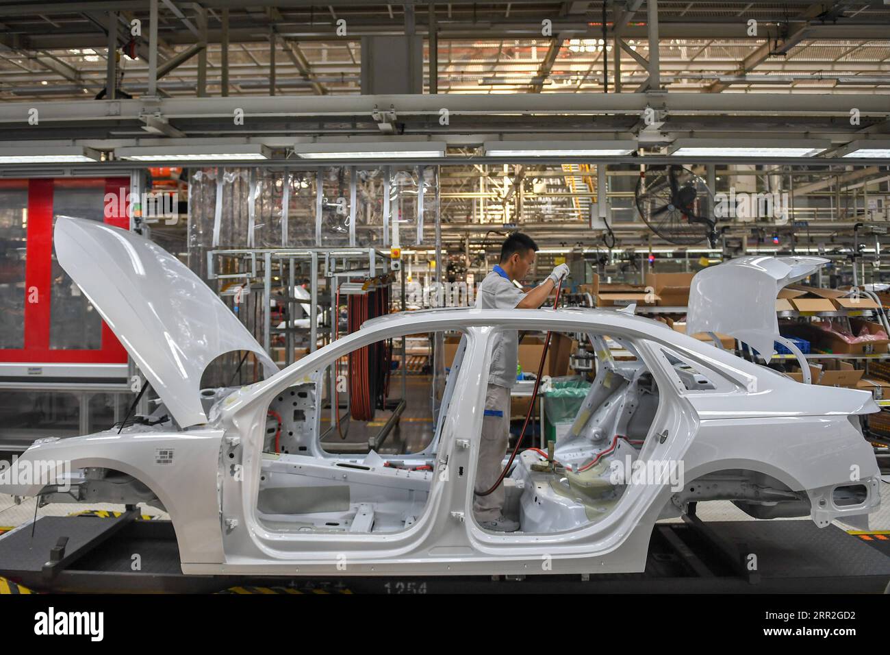 201012 -- CHANGCHUN, Oct. 12, 2020 -- A worker assembles a car at a factory of the First Automotive Works FAW Group Co., Ltd. in Changchun, capital of northeast China s Jilin Province, Sept. 1, 2020. China s leading automaker First Automotive Works FAW Group Co., Ltd. sold 2,656,744 vehicles in the first three quarters of the year, up 8 percent year on year, according to corporate sources.  CHINA-CHANGCHUN-FAW-SALES-GROWTH CN ZhangxNan PUBLICATIONxNOTxINxCHN Stock Photo