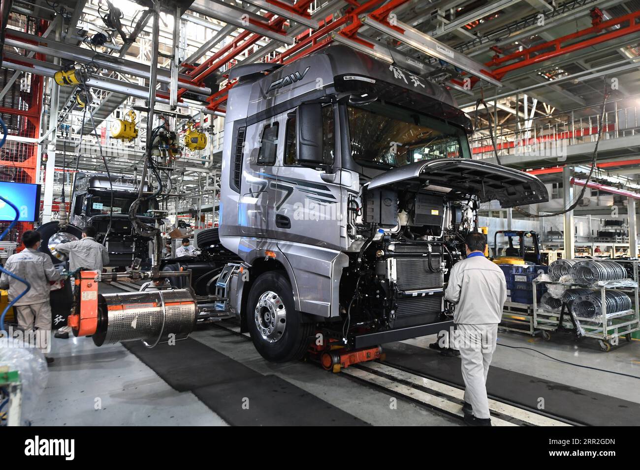 201012 -- CHANGCHUN, Oct. 12, 2020 -- Workers assemble vehicles at a factory of the First Automotive Works FAW Group Co., Ltd. in Changchun, capital of northeast China s Jilin Province, Sept. 23, 2020. China s leading automaker First Automotive Works FAW Group Co., Ltd. sold 2,656,744 vehicles in the first three quarters of the year, up 8 percent year on year, according to corporate sources.  CHINA-CHANGCHUN-FAW-SALES-GROWTH CN ZhangxNan PUBLICATIONxNOTxINxCHN Stock Photo