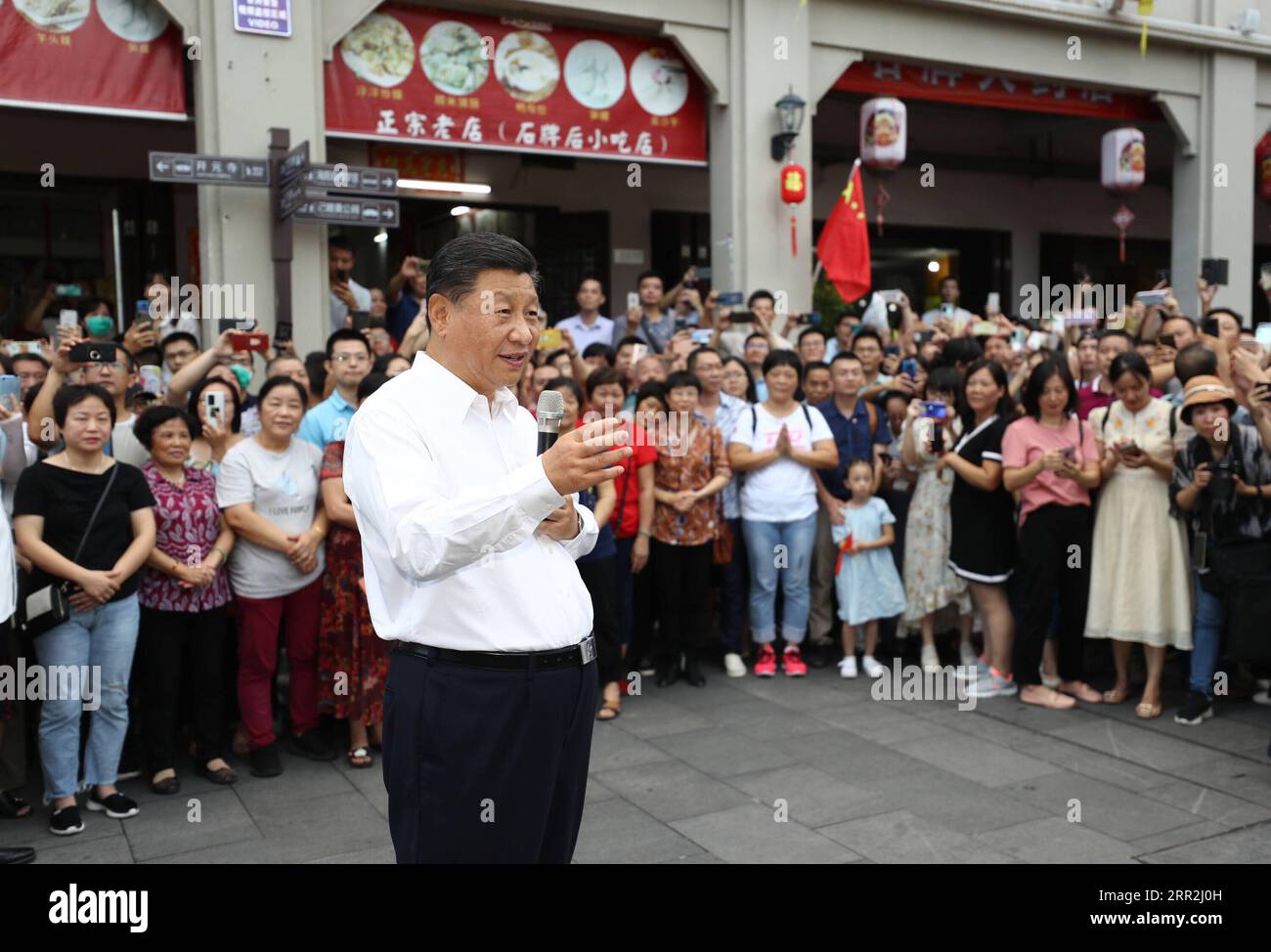 201013 -- CHAOZHOU, Oct. 13, 2020 -- Chinese President Xi Jinping, also general secretary of the Communist Party of China Central Committee and chairman of the Central Military Commission, speaks with people while visiting a street lined with ancient memorial archways in Chaozhou, south China s Guangdong Province, Oct. 12, 2020. Xi on Monday arrived in Guangdong to begin an inspection tour of the province.  CHINA-GUANGDONG-XI JINPING-INSPECTION CN JuxPeng PUBLICATIONxNOTxINxCHN Stock Photo