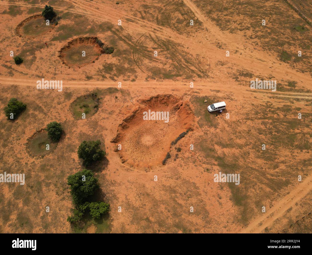 An aerial view of bomb craters on a dry field in Laos Stock Photo Alamy