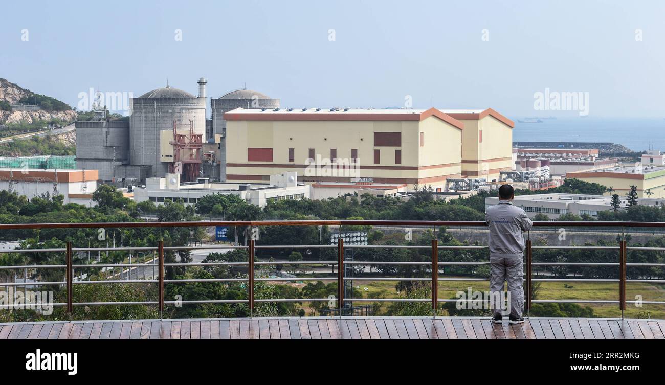 201014 -- SHENZHEN, Oct. 14, 2020 -- Qiao Sukai overlooks the Dayawan Nuclear Power Plant in Shenzhen, south China s Guangdong Province, Nov. 20, 2019. Every 18 months, the Dayawan Nuclear Power Plant has to undergo a fuel assemblies replacement, which is one of the most important moments for the nuclear power plant. Dozens of engineers are divided into four shifts and operate the equipment day and night when the reactor is shut down. Their leader, Qiao Sukai, has been dealing with nuclear fuel since July 1993 when the nuclear fuel assembly of Dayawan Nuclear Power Plant arrived. The professio Stock Photo