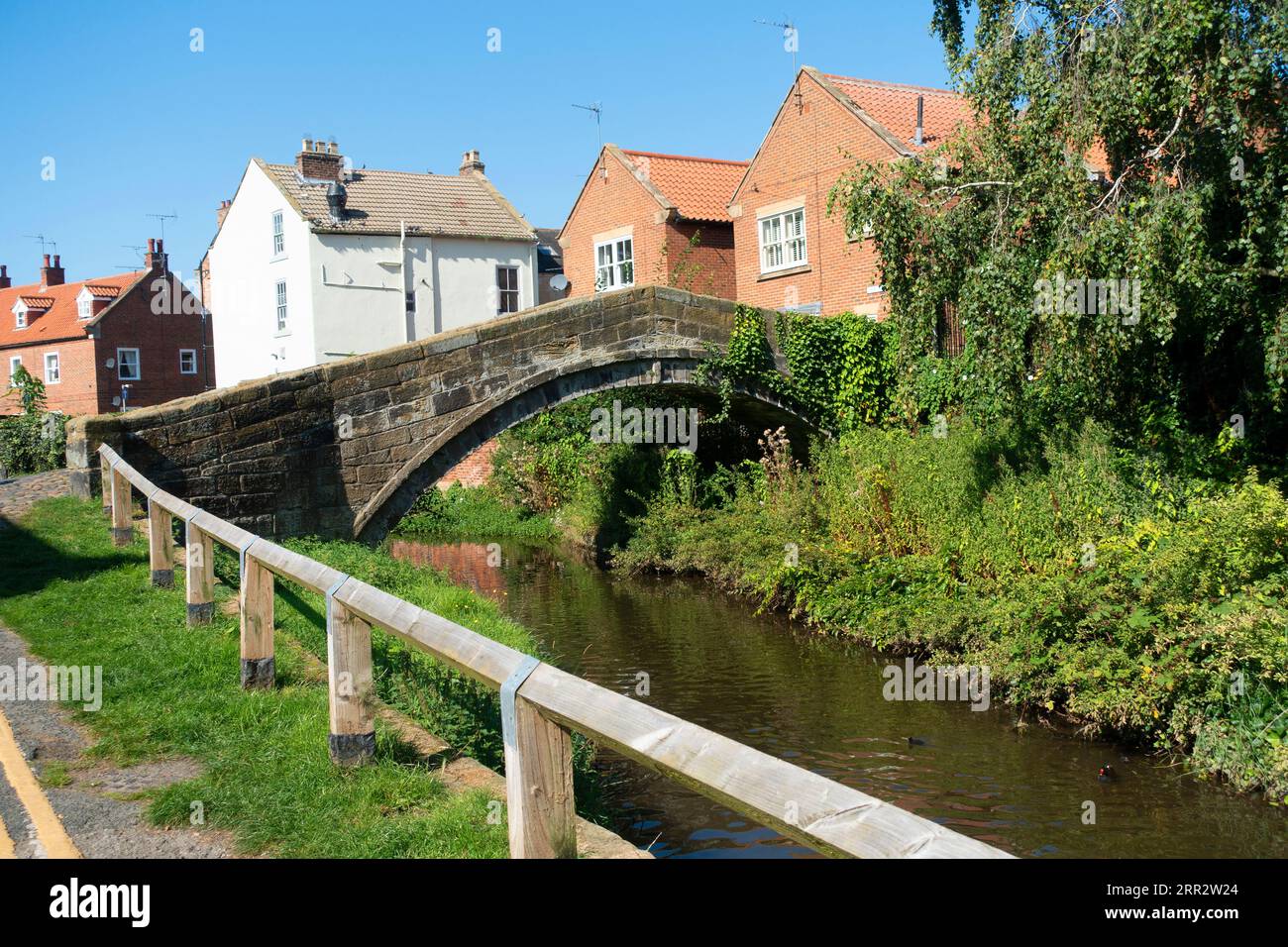 The 17C pack horse bridge over the river Leven in Stokesley North Yorkshire, on the old packhorse route from Durham to York Stock Photo