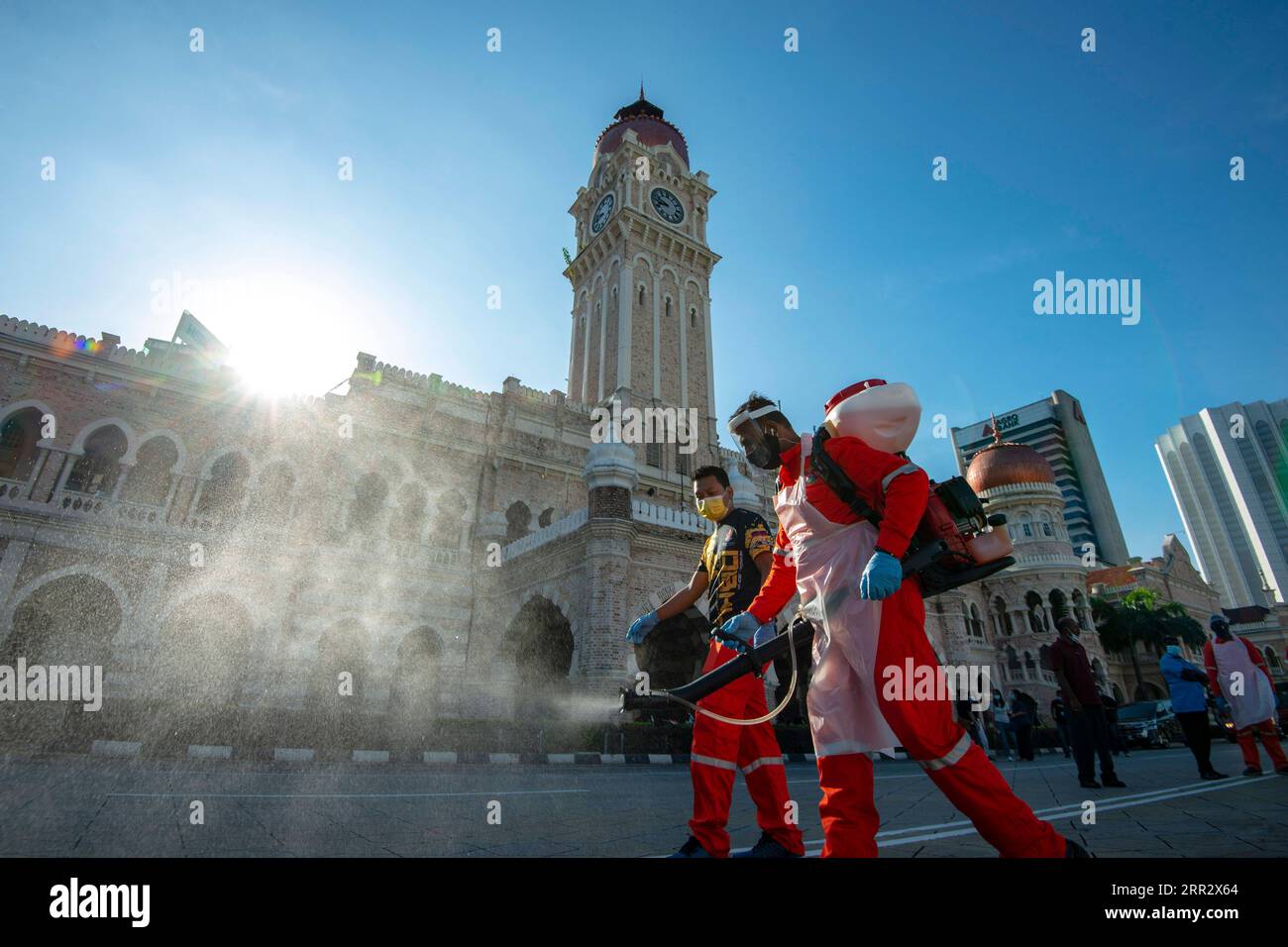 201017 -- KUALA LUMPUR, Oct. 17, 2020 -- Workers spray disinfectant near the Merdeka Square in Kuala Lumpur, Malaysia, Oct. 17, 2020. Malaysia reported 869 new COVID-19 infections in the highest daily spike since the outbreak, the Health Ministry said on Saturday, bringing the national total to 19,627. Photo by /Xinhua MALAYSIA-KUALA LUMPUR-COVID-19 ChongxVoonxChung PUBLICATIONxNOTxINxCHN Stock Photo