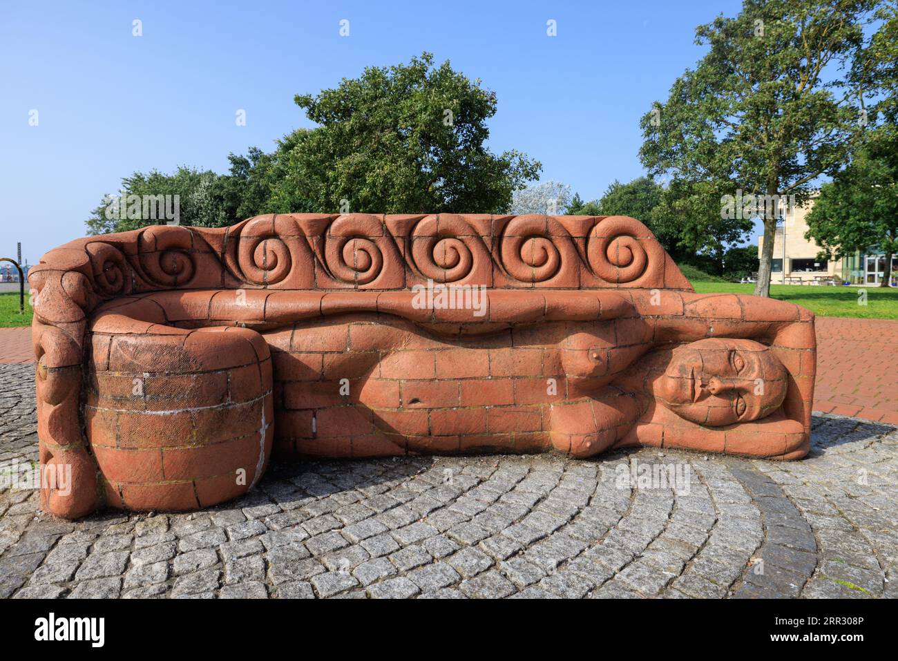 Carved terracotta bench by Gwen Heeney at Cardiff Bay, Wales, UK Stock Photo