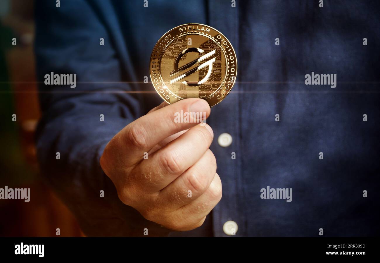 Stellar XLM cryptocurrency golden coin in hand abstract concept Stock Photo  - Alamy