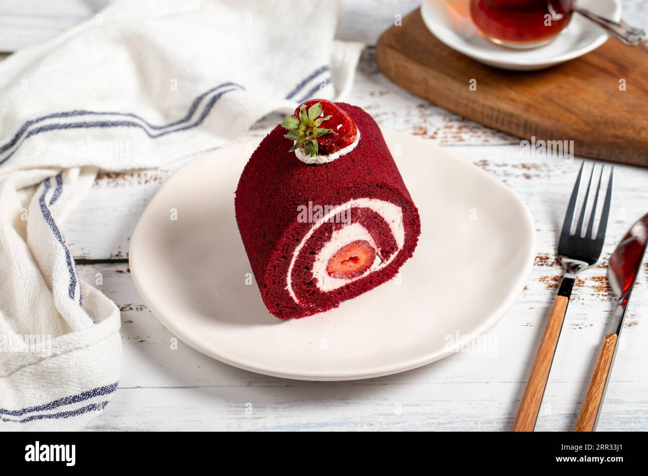 Strawberry and cream roll cake. Delicious cake with whipped cream and strawberries Stock Photo