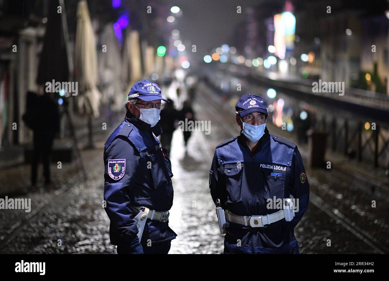 201023 -- MILAN, Oct. 23, 2020 -- Police officers patrol a street amid a spike in new coronavirus infections in Milan, Italy, Oct. 22, 2020. Over 21.7 million Italians, making up over one-third of the country s population, have been placed under curfew amid a spike in new coronavirus infections, which numbered 13,860 on Thursday, officials said. Photo by /Xinhua ITALY-MILAN-COVID-19-CURFEW DanielexMascolo PUBLICATIONxNOTxINxCHN Stock Photo