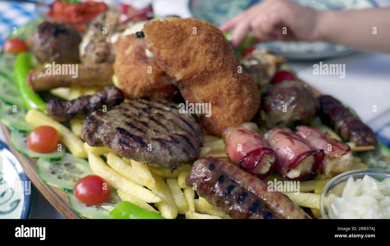 Feasting on Greek Flavors of Assorted Meats, Vegetables, and Sides Laid