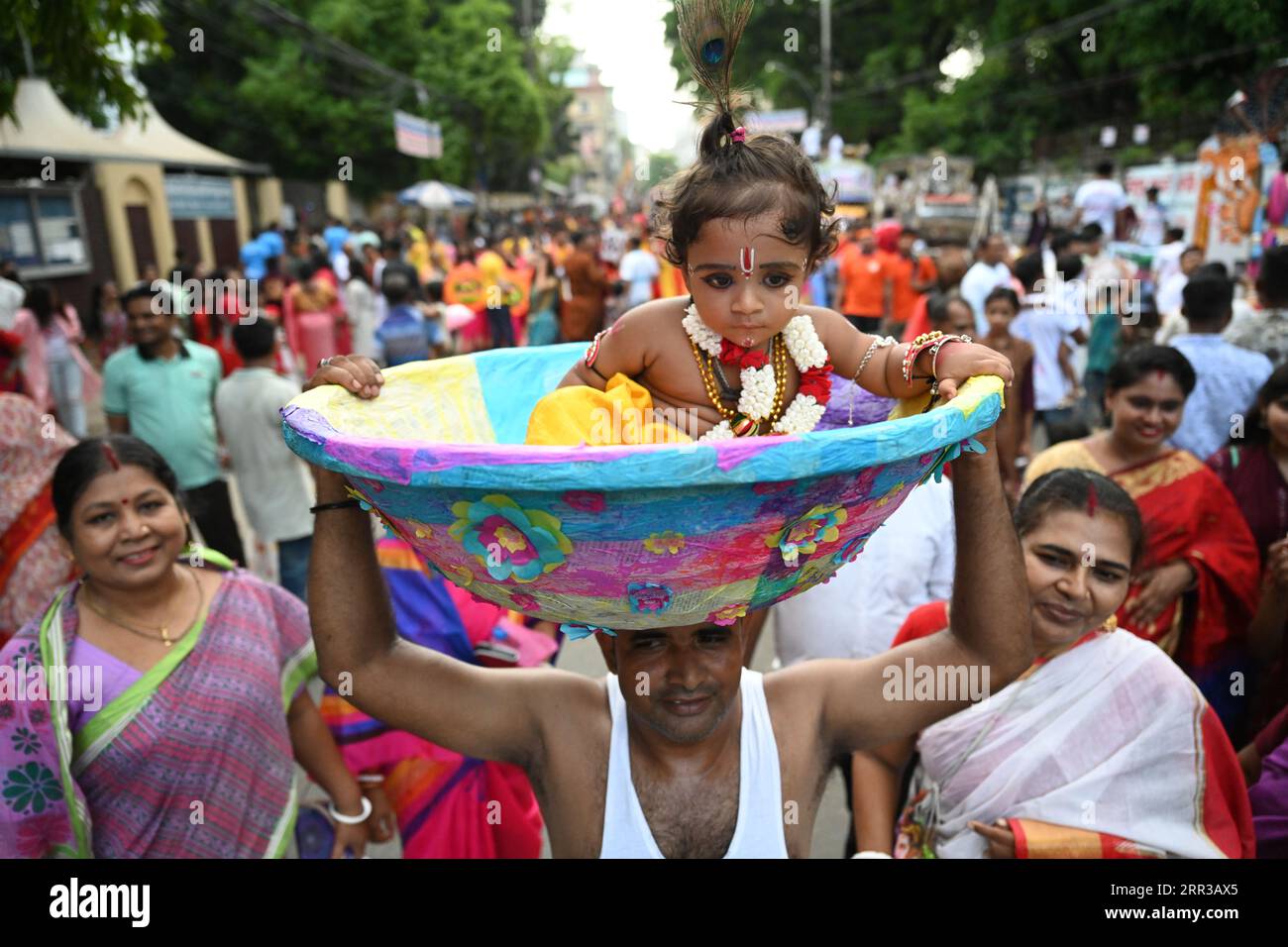 Dhaka, Bangladesh, on September 6, 2023. Hindu devotees parade as they take part in the celebrations of Janmashtami, a festival marking the birth of Hindu deity Krishna, in Dhaka, Bangladesh, on September 6, 2023. According to mythology and the Hinduism holy book Puranas, Krishna is the incarnation of Lord Vishnu, who took birth to kill his maternal uncle the evil king Kansa and free the people of Mathura and other nearby towns from his cruelty and save them from his evil clutches. Stock Photo