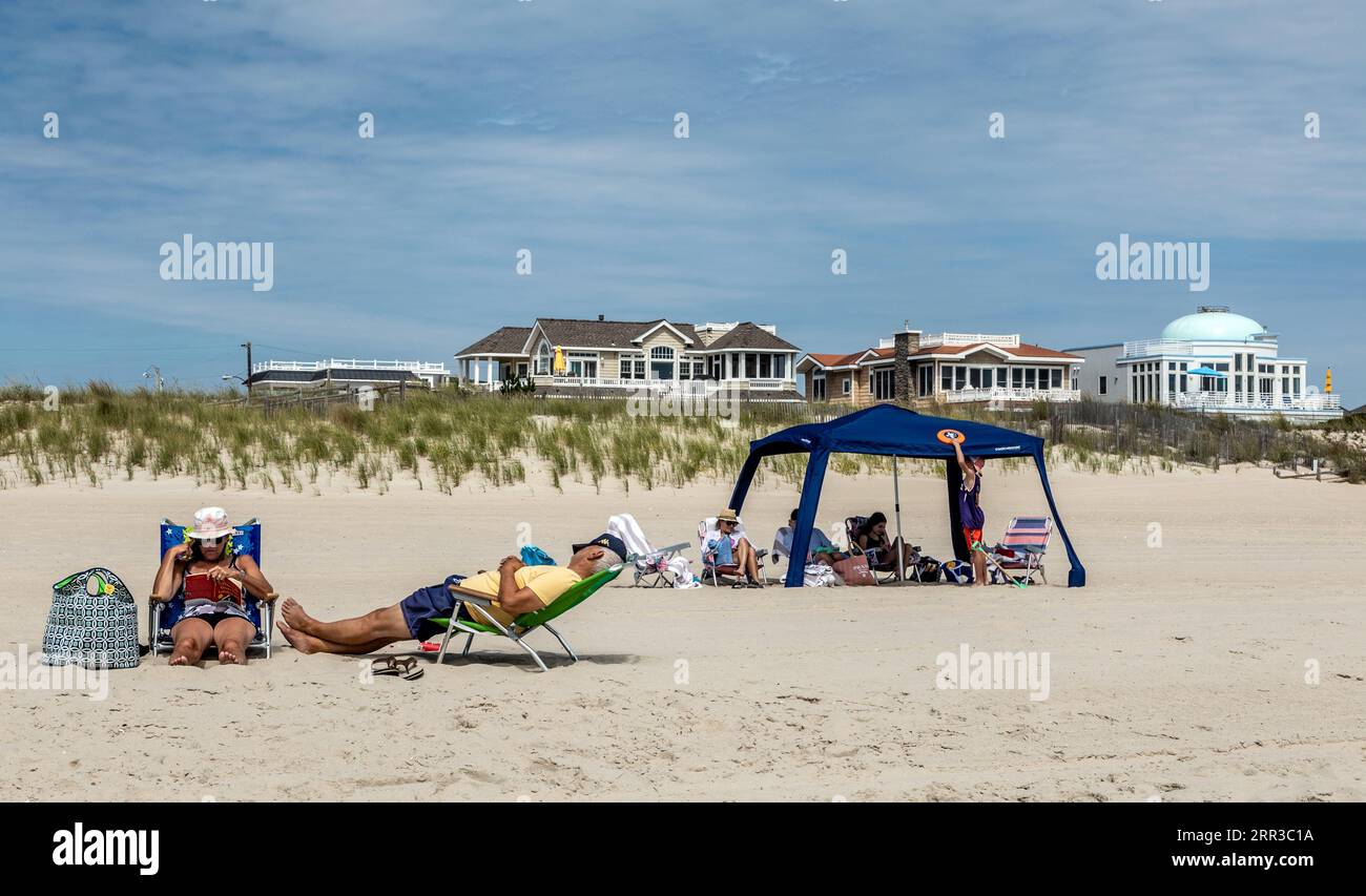 People Sitting on The Long Beach Island Beach Surf City New Jersey USA Stock Photo