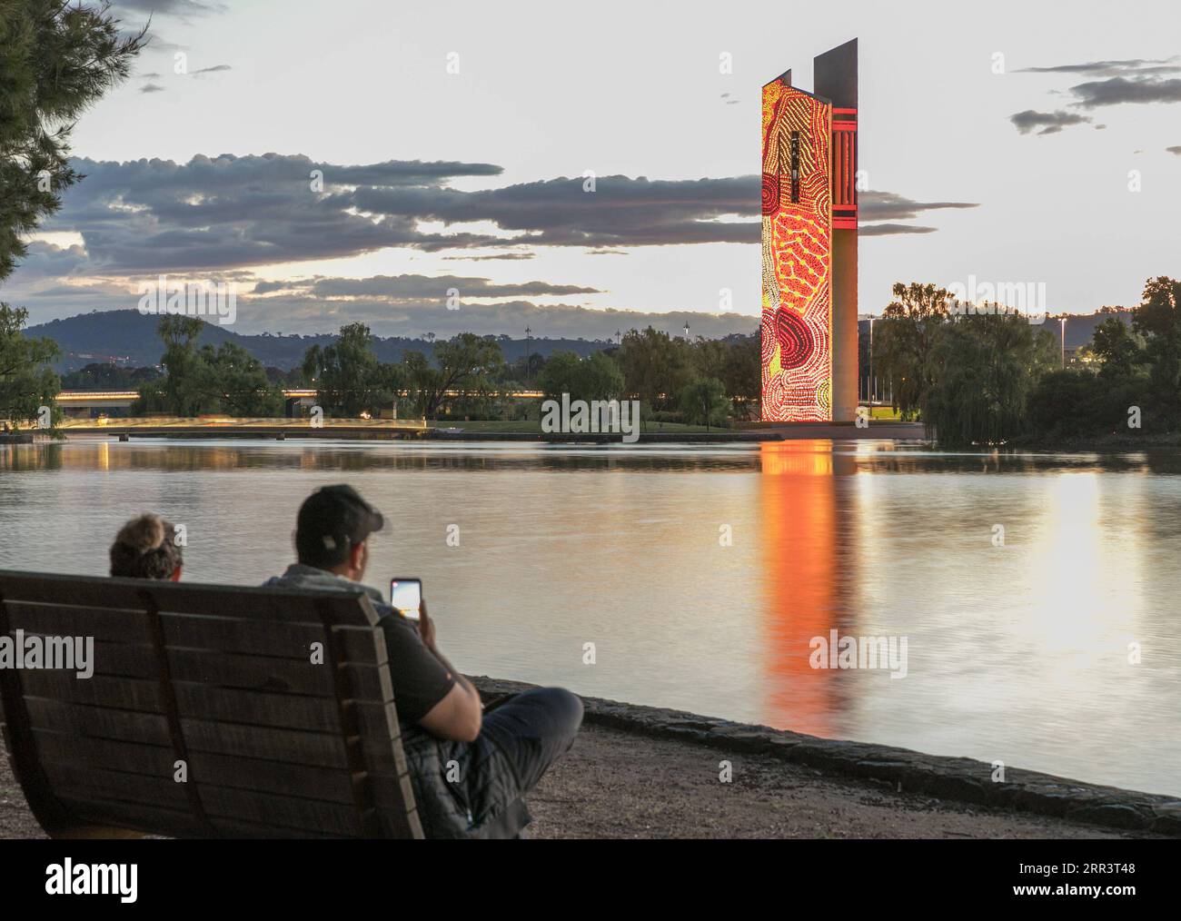 201111 -- CANBERRA, Nov. 11, 2020 -- People watch the light projections on the National Carillon in Canberra, Australia, Nov. 10, 2020. The National Carillon is illuminated with a series of indigenous artworks and designs from Aboriginal and Torres Strait Islander artists from Nov. 8 to 15. Photo by /Xinhua AUSTRALIA-CANBERRA-NATIONAL CARILLON-PROJECTIONS LiuxChangchang PUBLICATIONxNOTxINxCHN Stock Photo