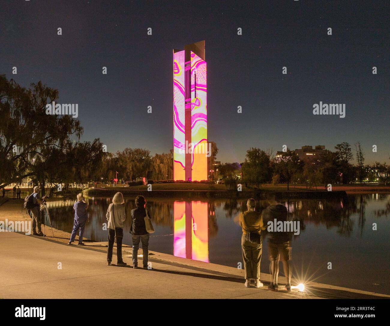 201111 -- CANBERRA, Nov. 11, 2020 -- People watch the light projections on the National Carillon in Canberra, Australia, Nov. 10, 2020. The National Carillon is illuminated with a series of indigenous artworks and designs from Aboriginal and Torres Strait Islander artists from Nov. 8 to 15. Photo by /Xinhua AUSTRALIA-CANBERRA-NATIONAL CARILLON-PROJECTIONS LiuxChangchang PUBLICATIONxNOTxINxCHN Stock Photo