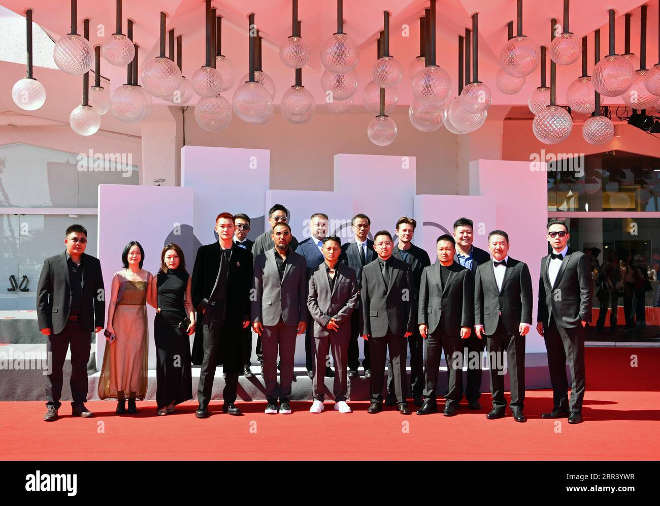 Venice, Italy. 6th Sep, 2023. Crew members of the film 'Xue Bao (Snow Leopard)' pose on the red carpet for the premiere of the film during the 80th Venice International Film Festival in Venice, Italy, Sept. 6, 2023. Credit: Jin Mamengni/Xinhua/Alamy Live News Stock Photo