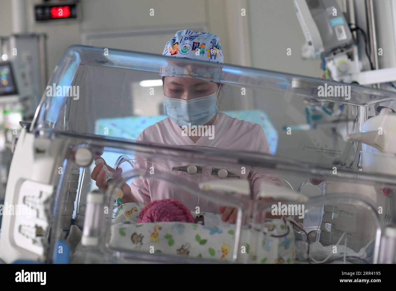 201116 -- HANGZHOU, Nov. 16, 2020 -- A nurse feeds milk to a preterm baby  in an intensive care unit ICU for newborn babies at the Children s Hospital  of Zhejiang University