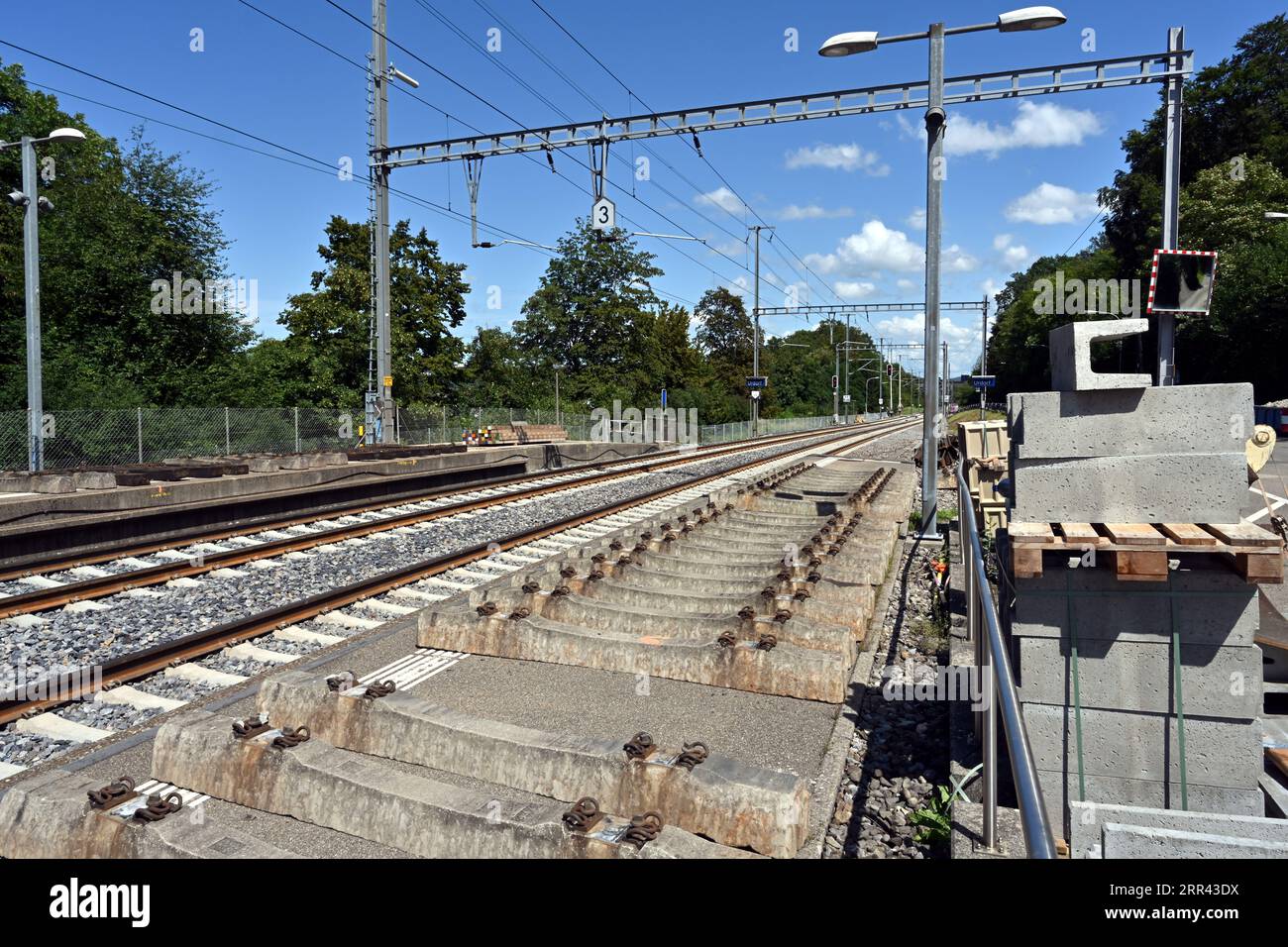 The rails leading from the railway station in village Urdorf in Switzerland. Stock Photo