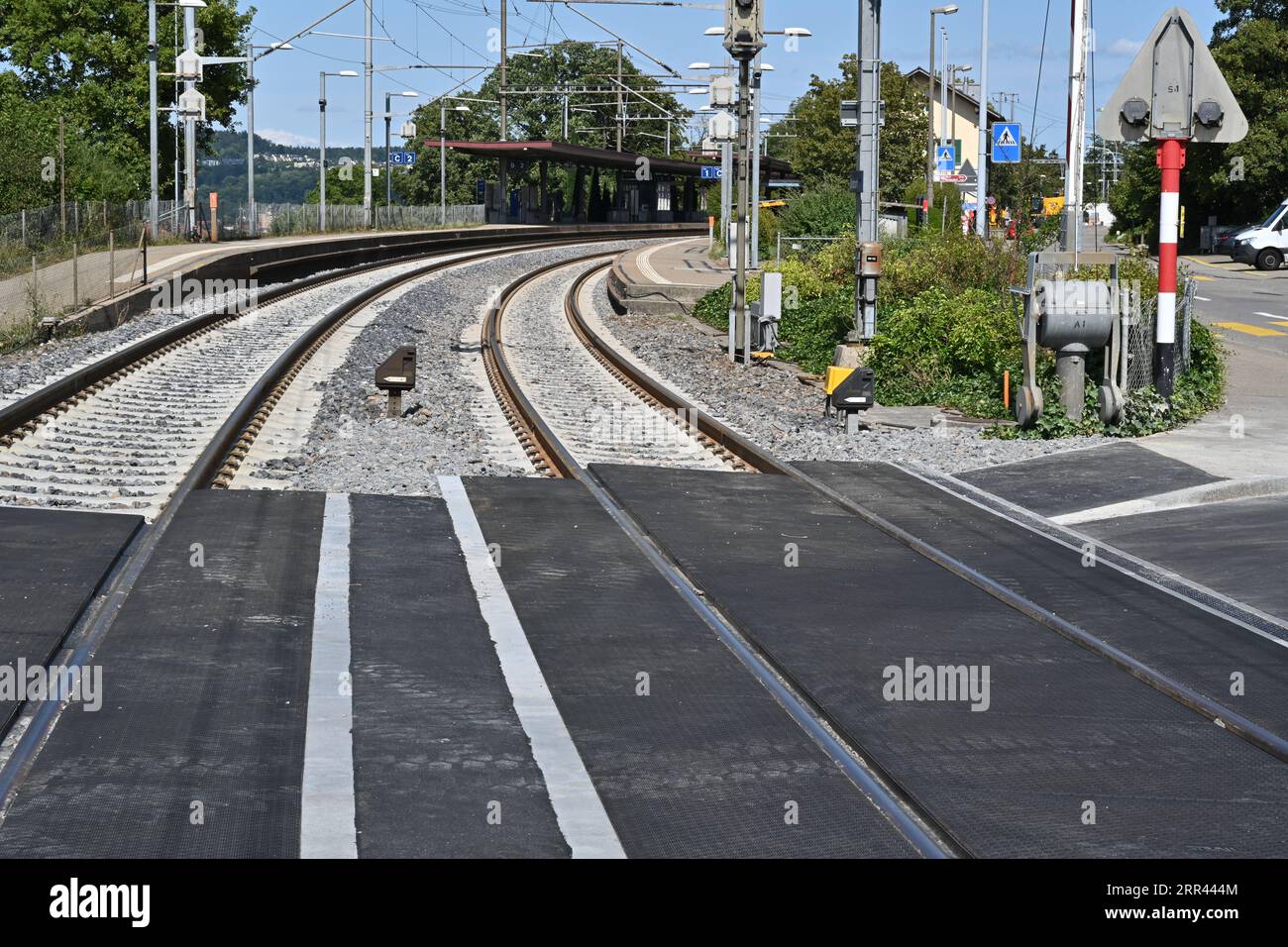 The tracks or rails and new railway crossing leading to the railway