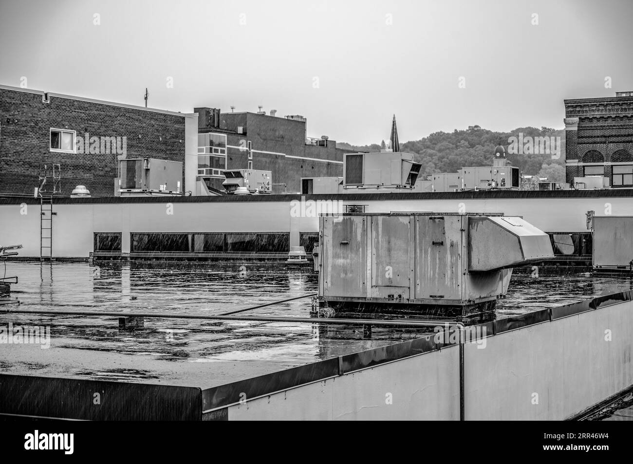 Rooftop industrial air handler during a rain storm Stock Photo Alamy