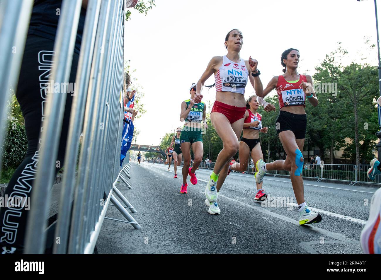 Brooks running shoes and CEP compression socks, legs female runner run  marathon in city, summer sports race Stock Photo - Alamy