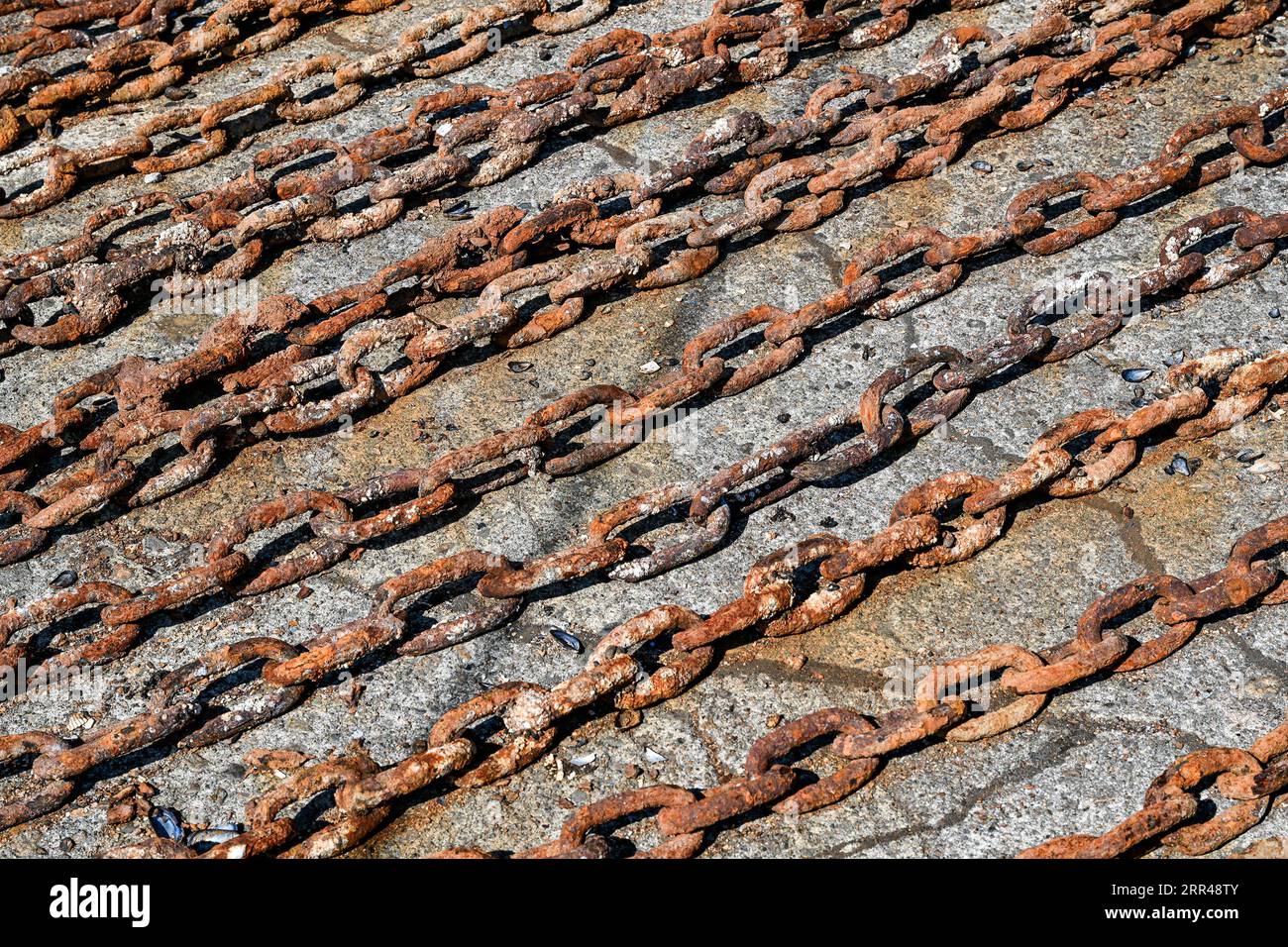 rows of rusty anchor chain Stock Photo