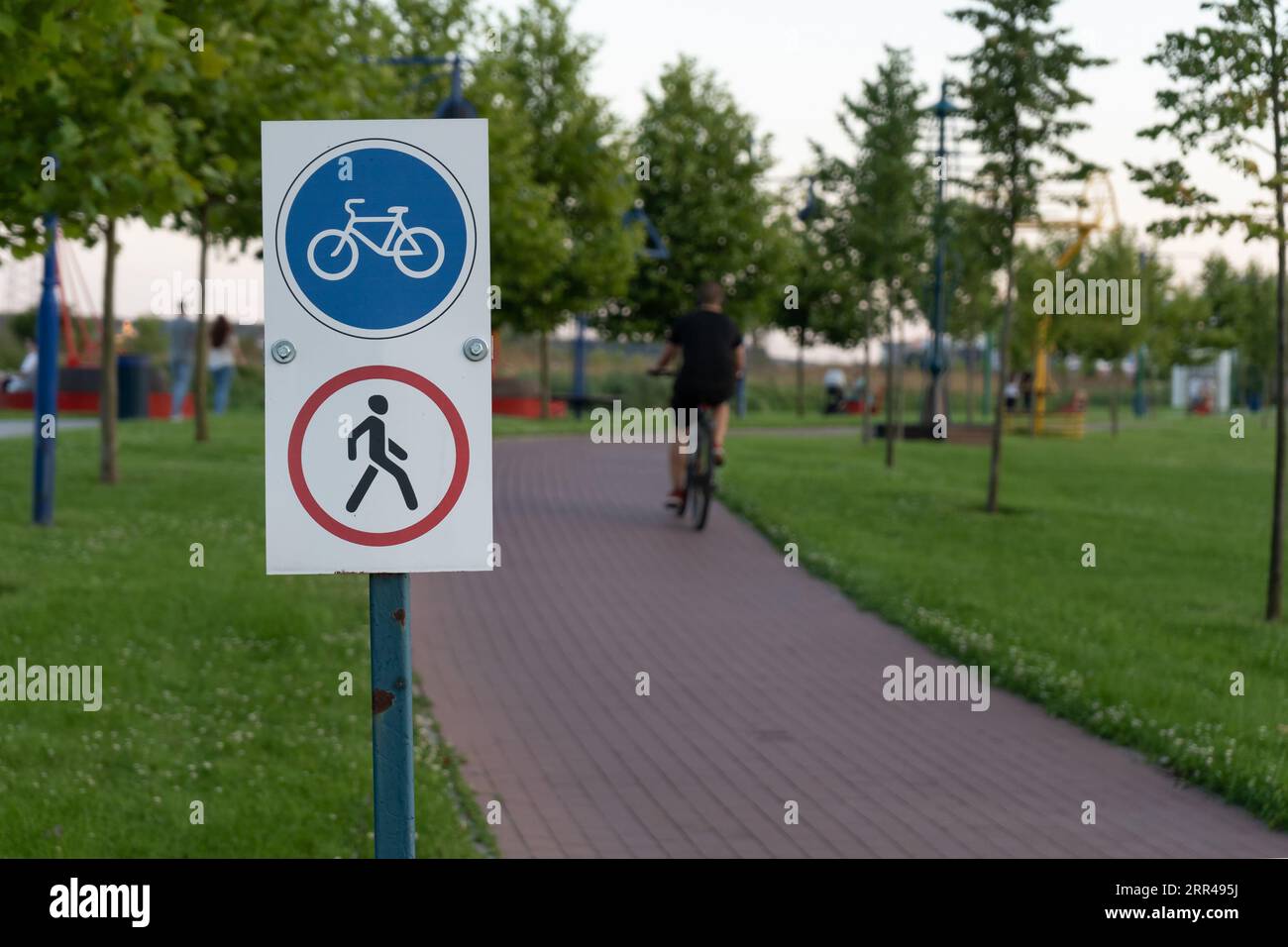 Road sign prohibiting pedestrians, cyclists allowed. The bicycle lane