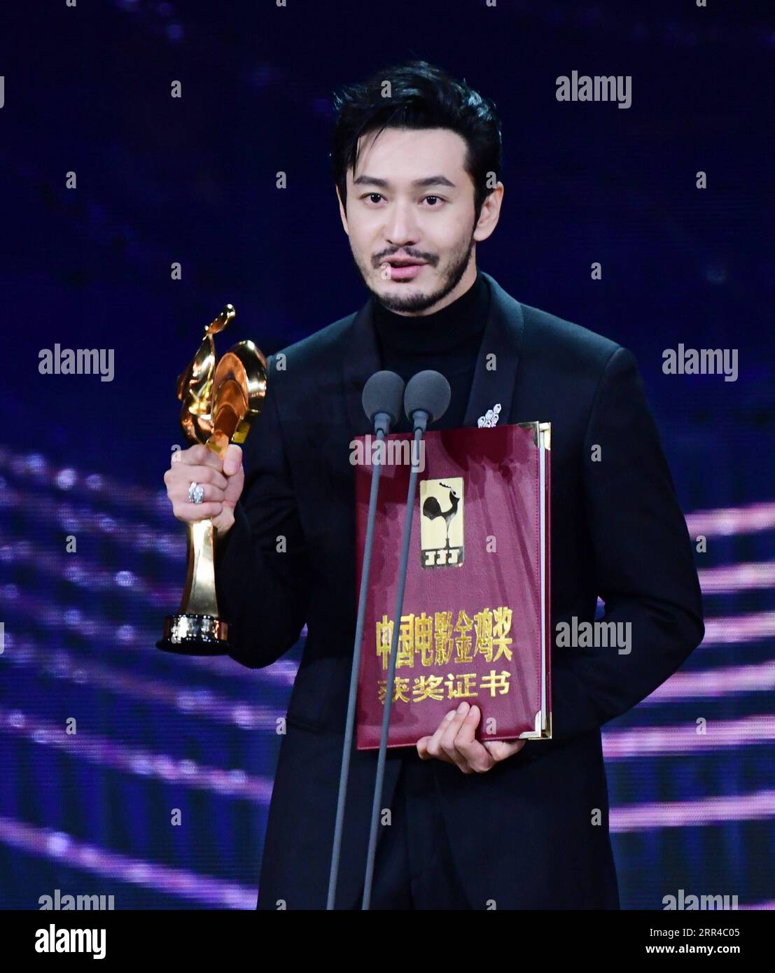 201128 -- XIAMEN, Nov. 28, 2020 -- Huang Xiaoming is honored with the Best Actor Award at the awarding ceremony of the 33rd China Film Golden Rooster Awards held in Xiamen, southeast China s Fujian Province, Nov. 28, 2020.  CHINA-FUJIAN-XIAMEN-FILM-33RD GOLDEN ROOSTER AWARDS-AWARDING CEREMONY CN WeixPeiquan PUBLICATIONxNOTxINxCHN Stock Photo
