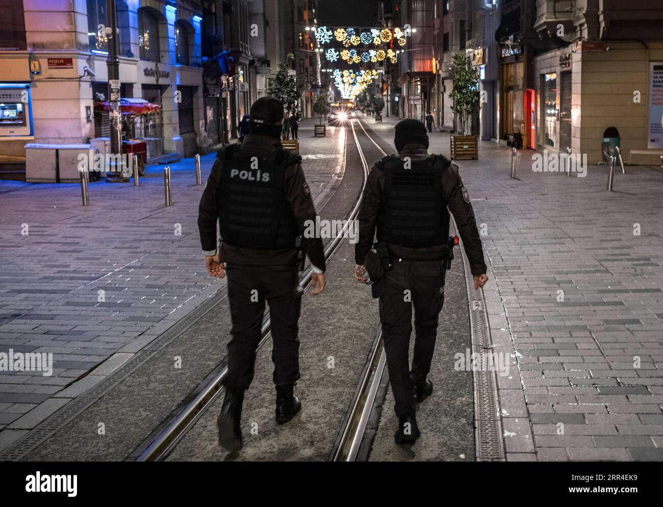 201202 -- ISTANBUL, Dec. 2, 2020 -- Police officers patrol on the street during a curfew, part of the new measures to curb the spread of the coronavirus, in Istanbul, Turkey, Dec. 1, 2020. Turkey confirmed 30,110 new coronavirus cases, including 6,101 symptomatic patients, raising the total number of infections and symptomatic COVID-19 patients in the country to 668,957 and 506,966, respectively, Turkey s Health Ministry said on Tuesday. Turkey also saw on Tuesday the first nighttime curfew imposed on weekdays to curb the hike in the number of COVID-19 cases. Local residents emptied boulevards Stock Photo