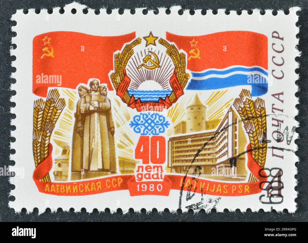 Cancelled postage stamp printed by USSR, that celebrates 40th Anniversary of Latvian SSR, circa 1980. Stock Photo