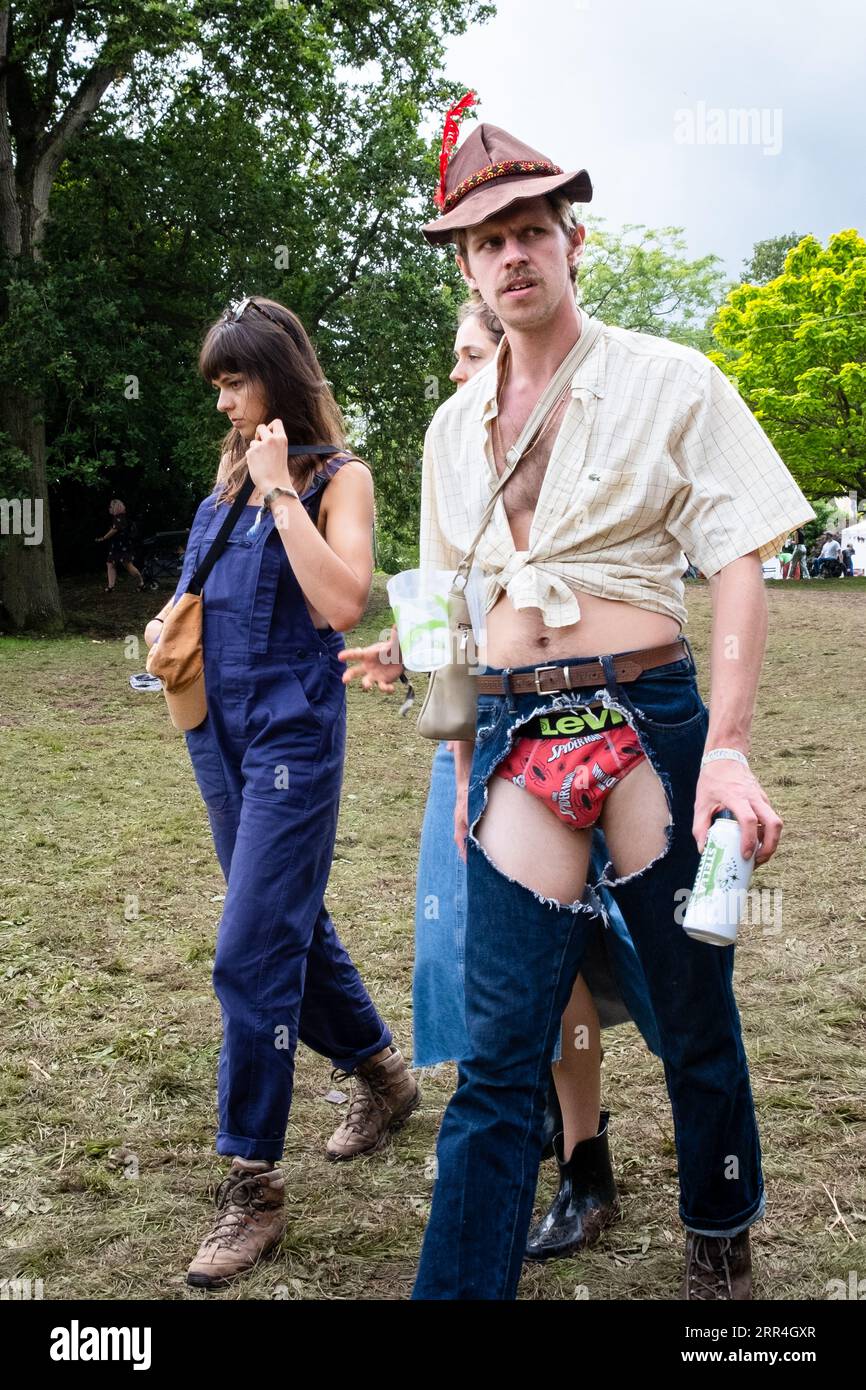 https://c8.alamy.com/comp/2RR4GXR/a-man-with-a-bavarian-hat-and-crotchless-torn-jeans-showing-his-spider-man-underpants-at-green-man-festival-brecon-wales-uk-2023-photo-rob-watki-2RR4GXR.jpg
