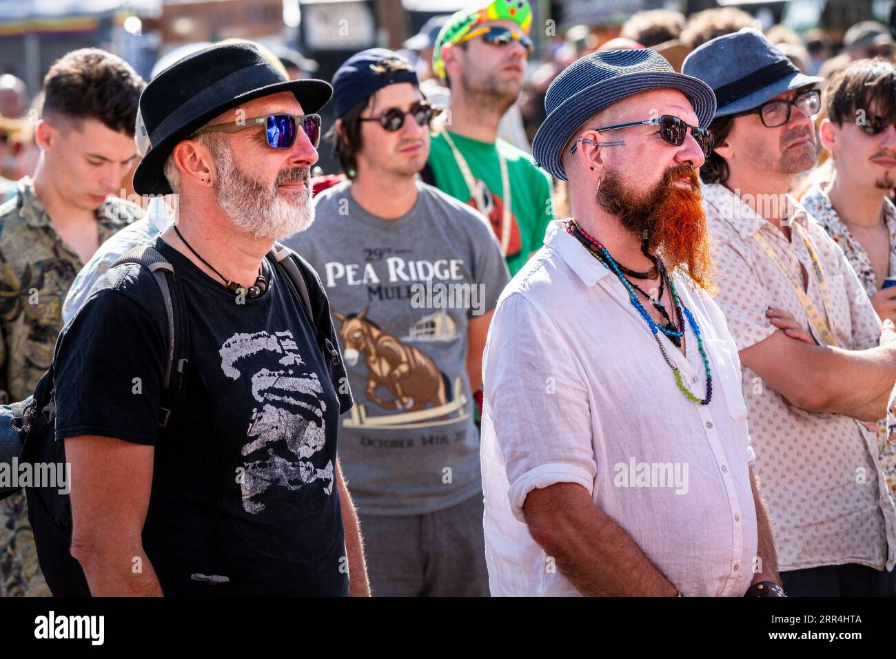 Middle aged men with hats and shades in the Walled Garden at Green Man Festival, Brecon, Wales, UK, 2023. Photo: Rob Watkins Stock Photo