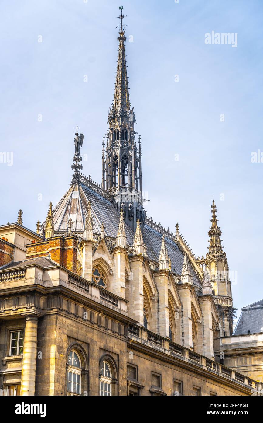 Exterior of Sainte-Chapelle with narrow and spiky spire. Palais de la ...