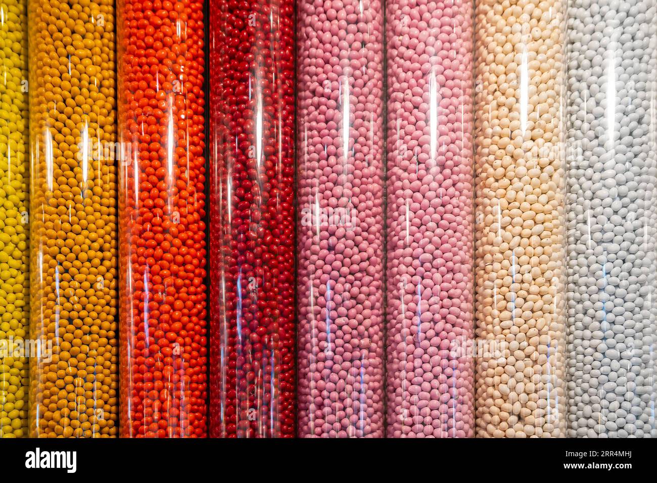 New York, USA - July 22nd, 2023: Dispensers full of various colors and tastes of candies in an M&M's store in New York. Stock Photo