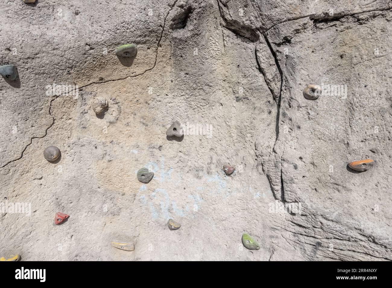 An outside rock with climbing holds for training. Stock Photo