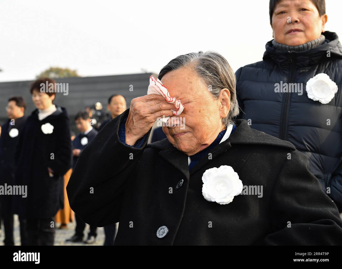 201213 -- NANJING, Dec. 13, 2020 -- Survivor of the Nanjing Massacre Xia Shuqin front attends the national memorial ceremony for the Nanjing Massacre victims at the Memorial Hall of the Victims of the Nanjing Massacre by Japanese Invaders in Nanjing, capital of east China s Jiangsu Province, Dec. 13, 2020.  CHINA-JIANGSU-NANJING MASSACRE VICTIMS-NATIONAL MEMORIAL CEREMONY CN LixXiang PUBLICATIONxNOTxINxCHN Stock Photo