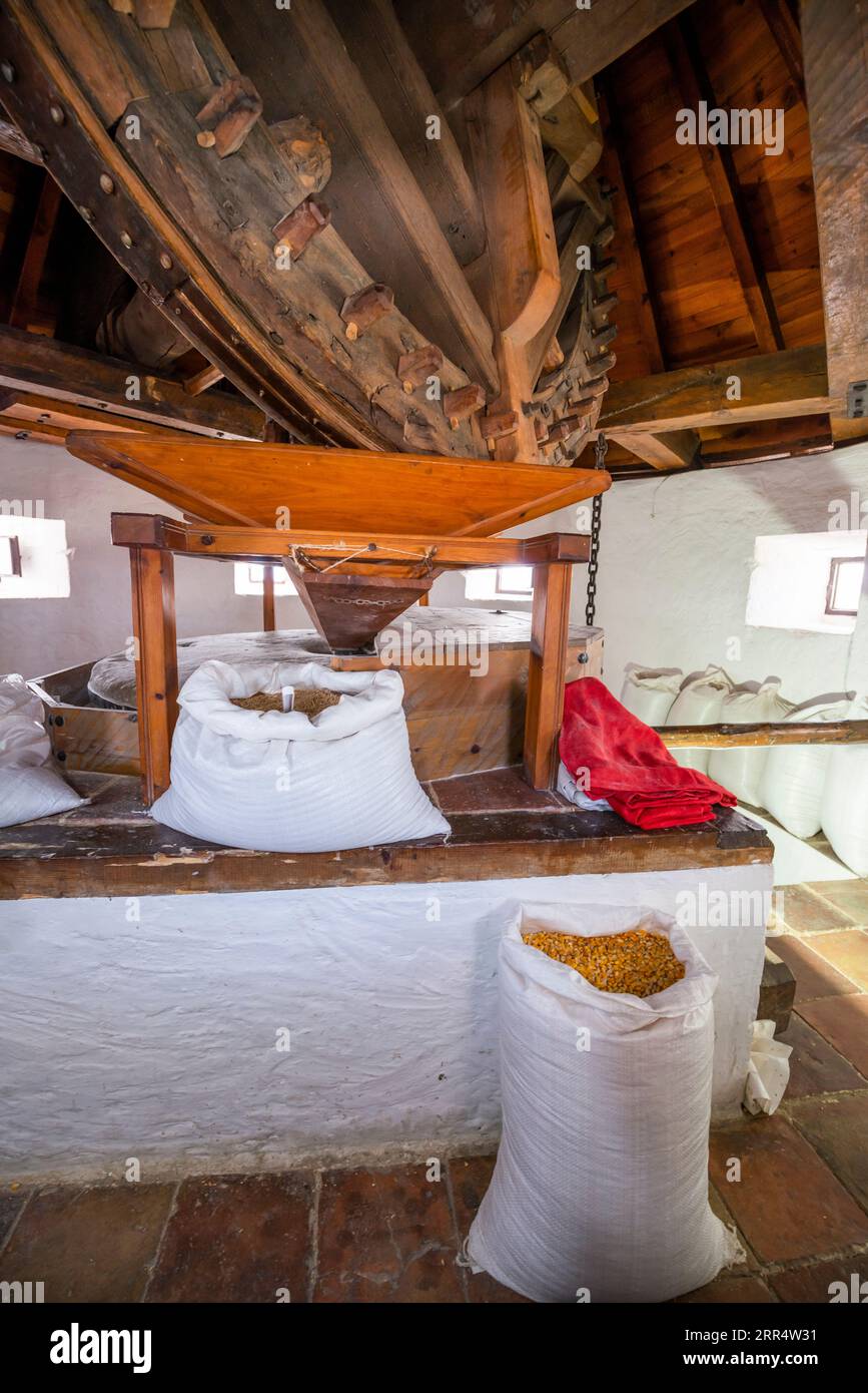 Interior of an old windmill with a representation of grain grinding Stock Photo