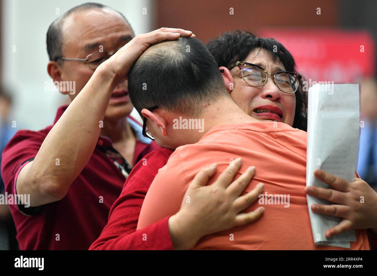 201216 -- BEIJING, Dec. 16, 2020 -- Mao Yin hugs his parents after being abducted as a toddler 32 years ago in Xi an, northwest China s Shaanxi Province, May 18, 2020. Born in February 1986, Mao was abducted when he was two and a half years old at the entrance of a hotel in Xi an. Looking back at 2020, there are always some warm pictures and touching moments: the dedication on the front line to fight against the epidemic, the perseverance on the way out of poverty, the courage to shoulder the responsibility on the embankment against the flood, the joy and pride when reaching the summit of Moun Stock Photo