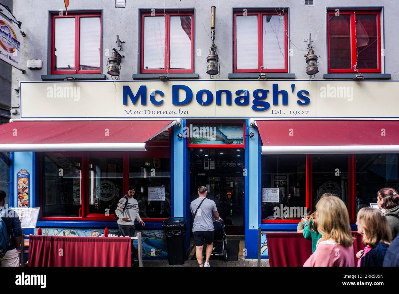 McDonaghs traditional family run Fish and Chip Bar and Seafood Restaurant in Quay Street, Galway, Ireland. Trading since 1902. Stock Photo