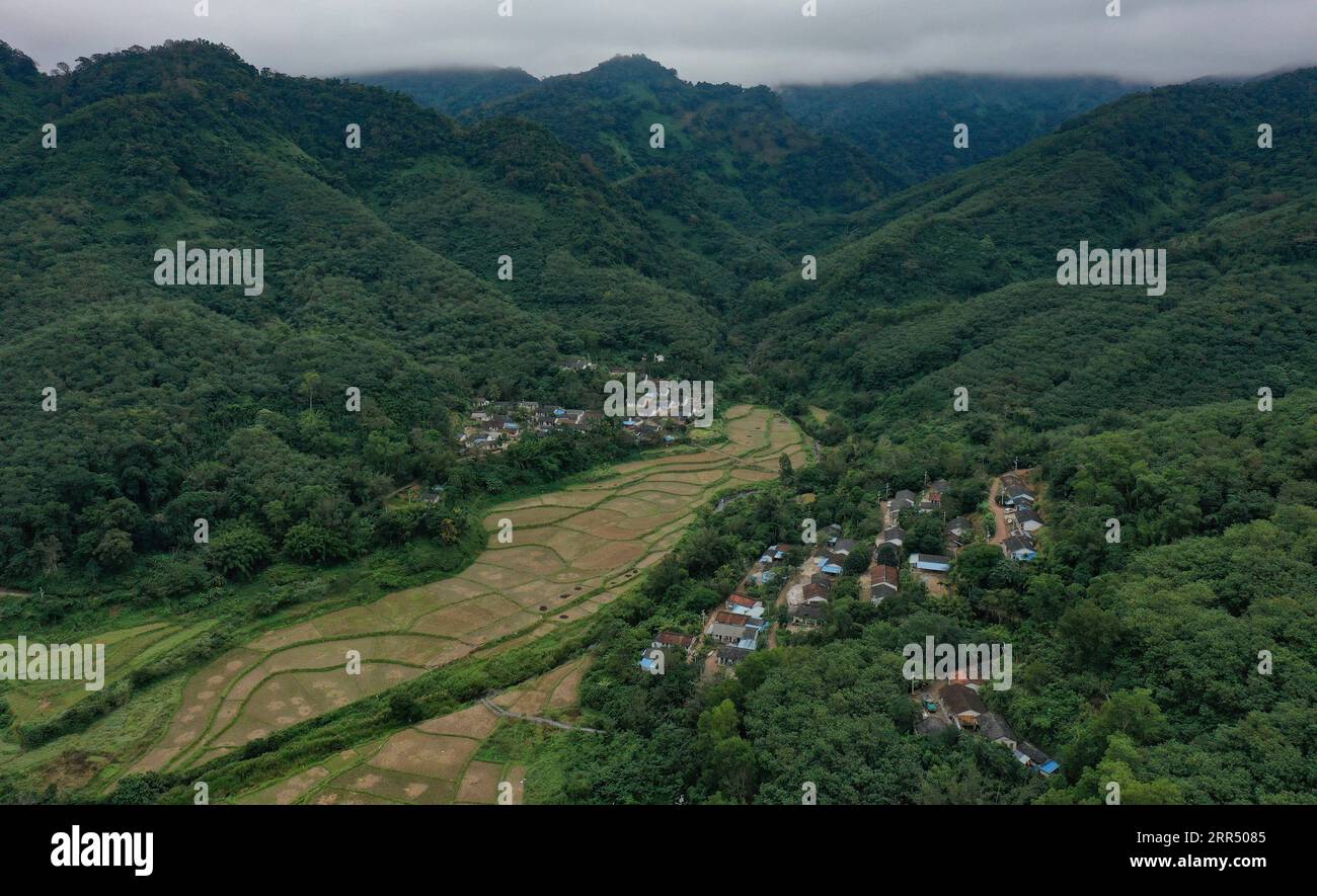 201217 -- BAISHA, Dec. 17, 2020 -- Aerial photo taken on Dec. 15, 2020 shows a view of Gaofeng Village located deep in the valleies in Baisha Li Autonomous County in south China s Hainan Province. Gaofeng Village sits in central part of the Yinggeling National Nature Reserve, almost isolated from the outer world due to poor condition of mountainous trails. More than 100 families in the village had been living in deep poverty before 2015 as many of them had no access to electricity, mobile telecommunication, and Internet services. They nearly had no alternative source of income apart from rubbe Stock Photo