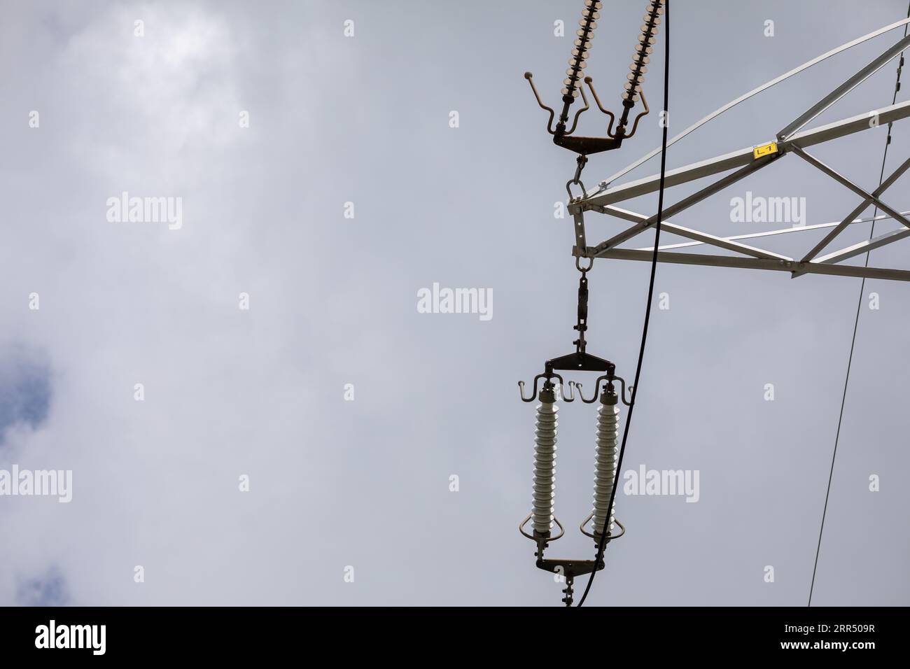 Bottom view of a section of a high-voltage overhead line pole Stock ...