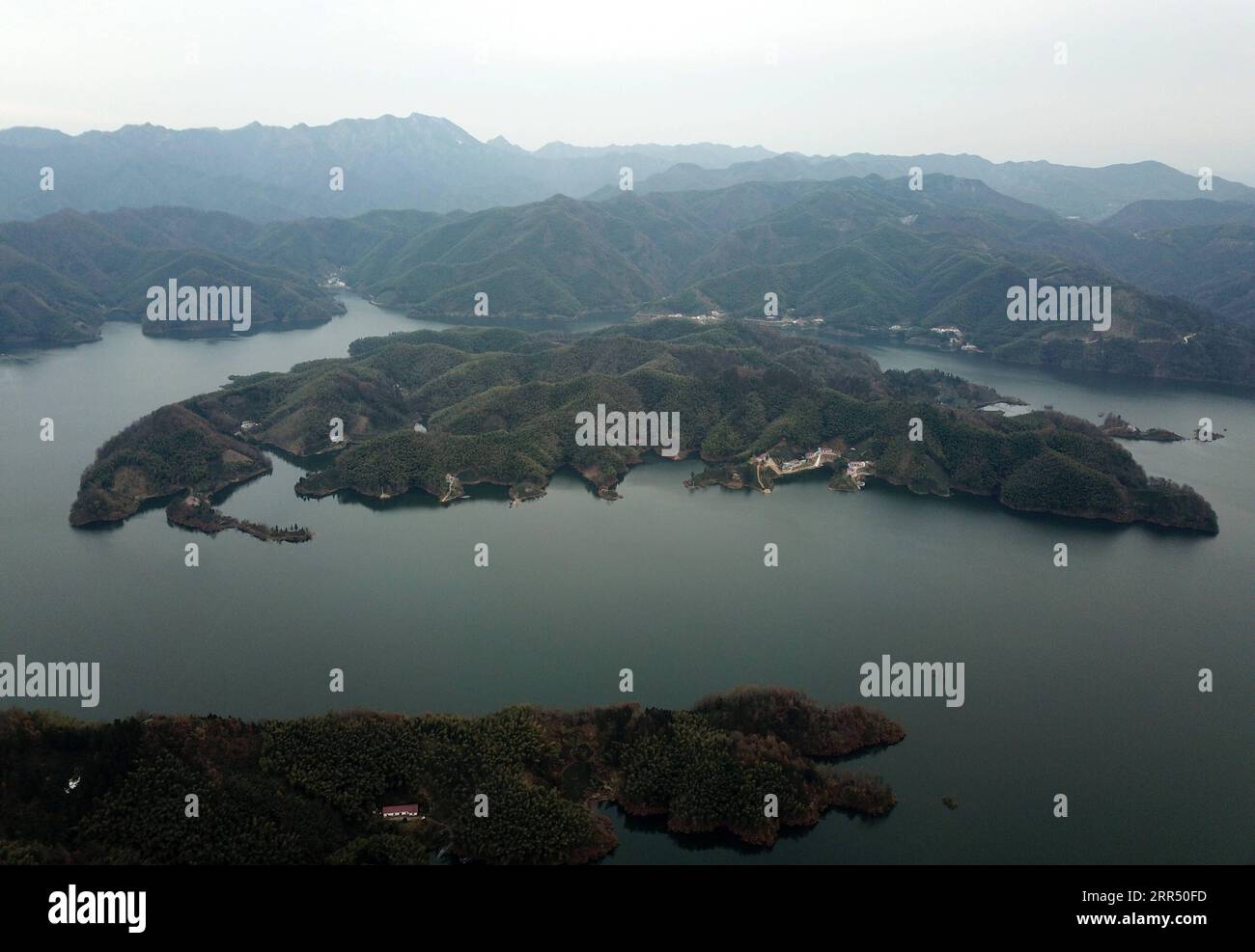 201218 -- JINZHAI, Dec. 18, 2020 -- Aerial photo taken on Dec. 15, 2020 shows the island where Yu Jiajun s health station is located in Jinzhai County of Luan City, east China s Anhui Province. Deep in the Xianghongdian Reservoir area in Jinzhai County of Luan City, east China s Anhui Province, there is an isolated island, which used to be home to over 40 poor families. Yu Jiajun, 42, is the only doctor in the village. In the past, there was no health station on the island. Villagers had to row a boat for two or three hours to go to the health center in Mabu Township to see the doctor. Yu said Stock Photo